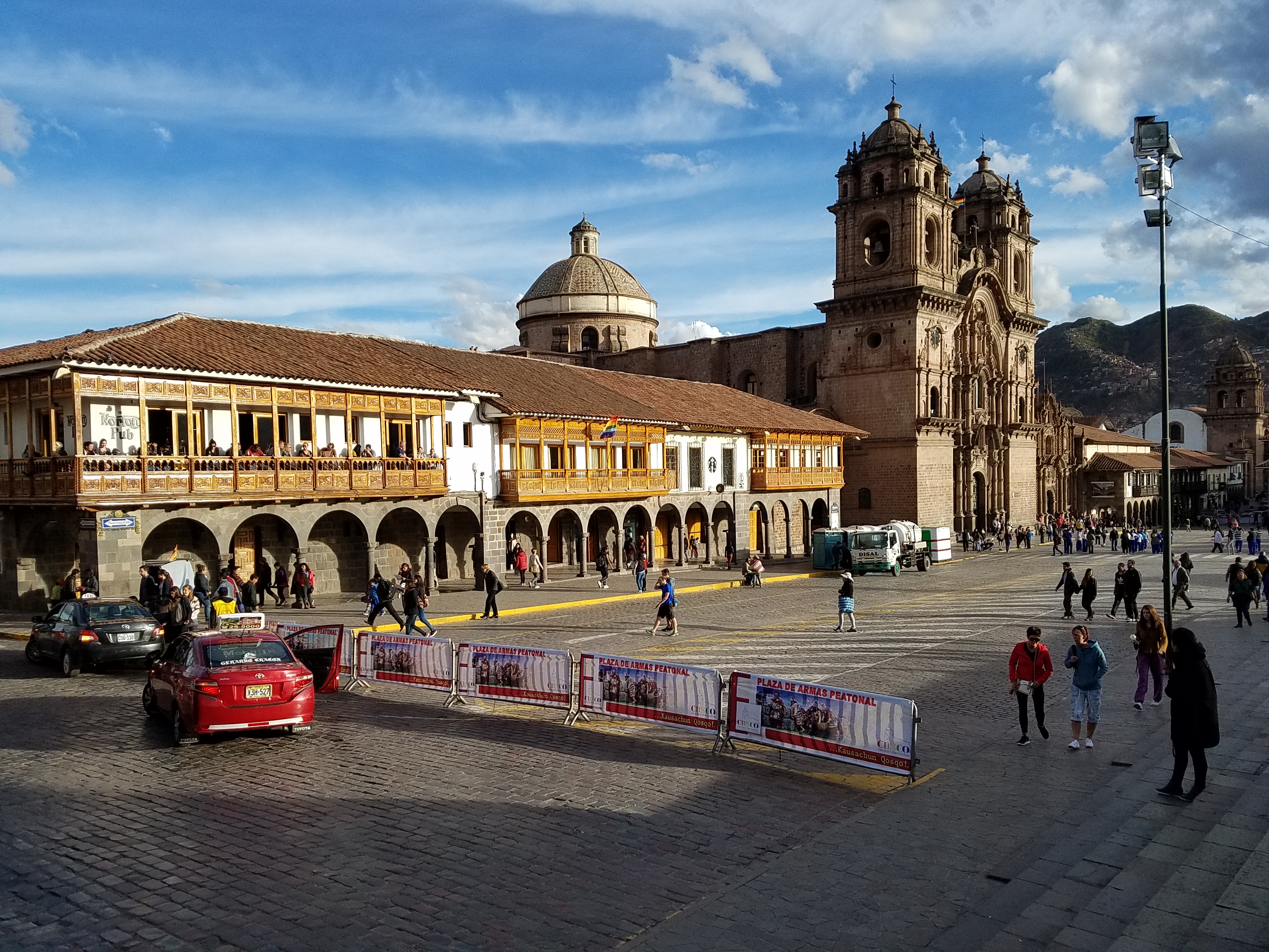 A colonial building and the Iglesia de la Compania de Jesus (Church of the Society of Jesus) on the Plaza de Armas (Parade Square) in Cusco. 