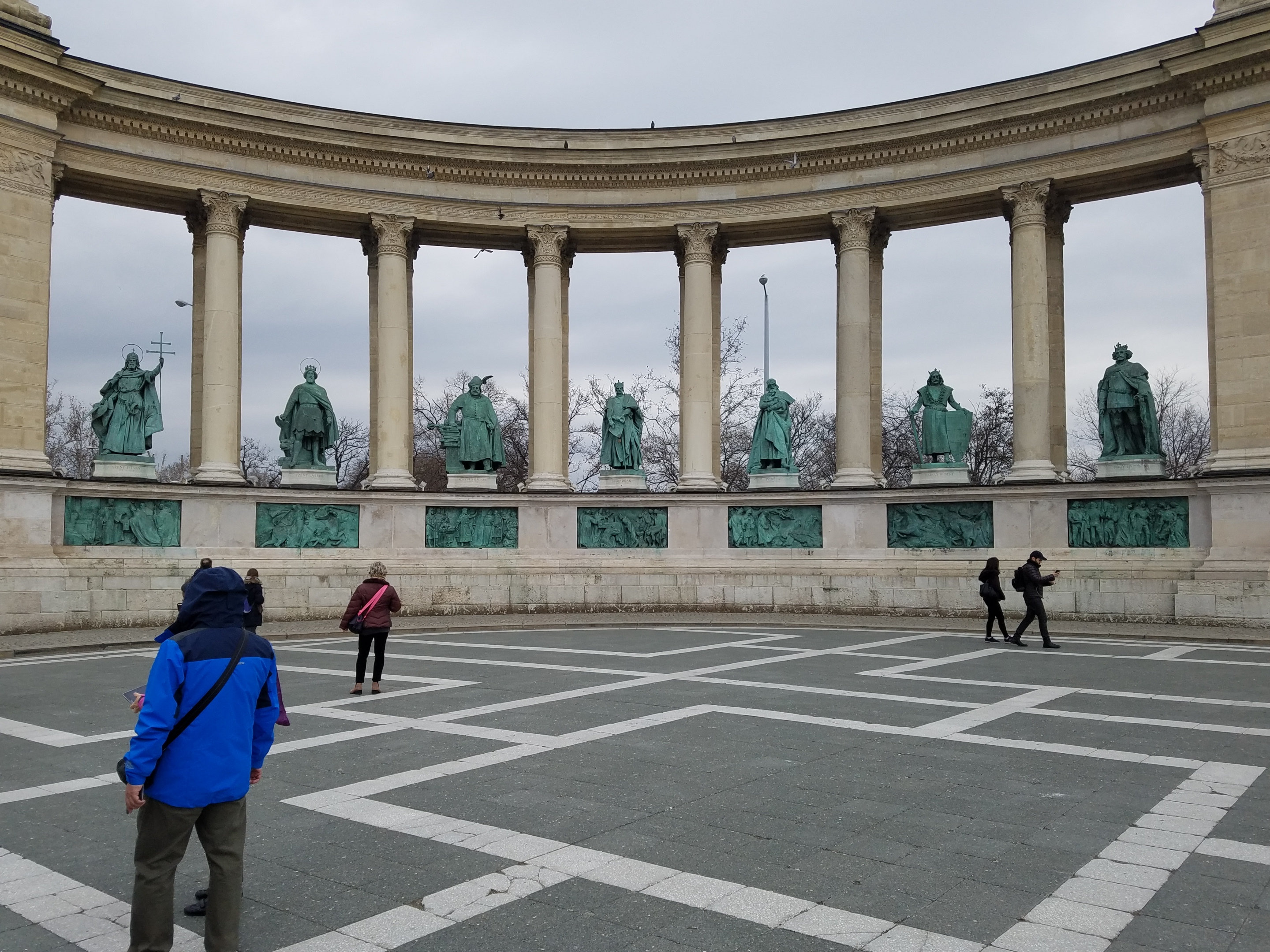 The statues of kings and military leaders in the left colonnade of the Millennium Monument in Budapest.