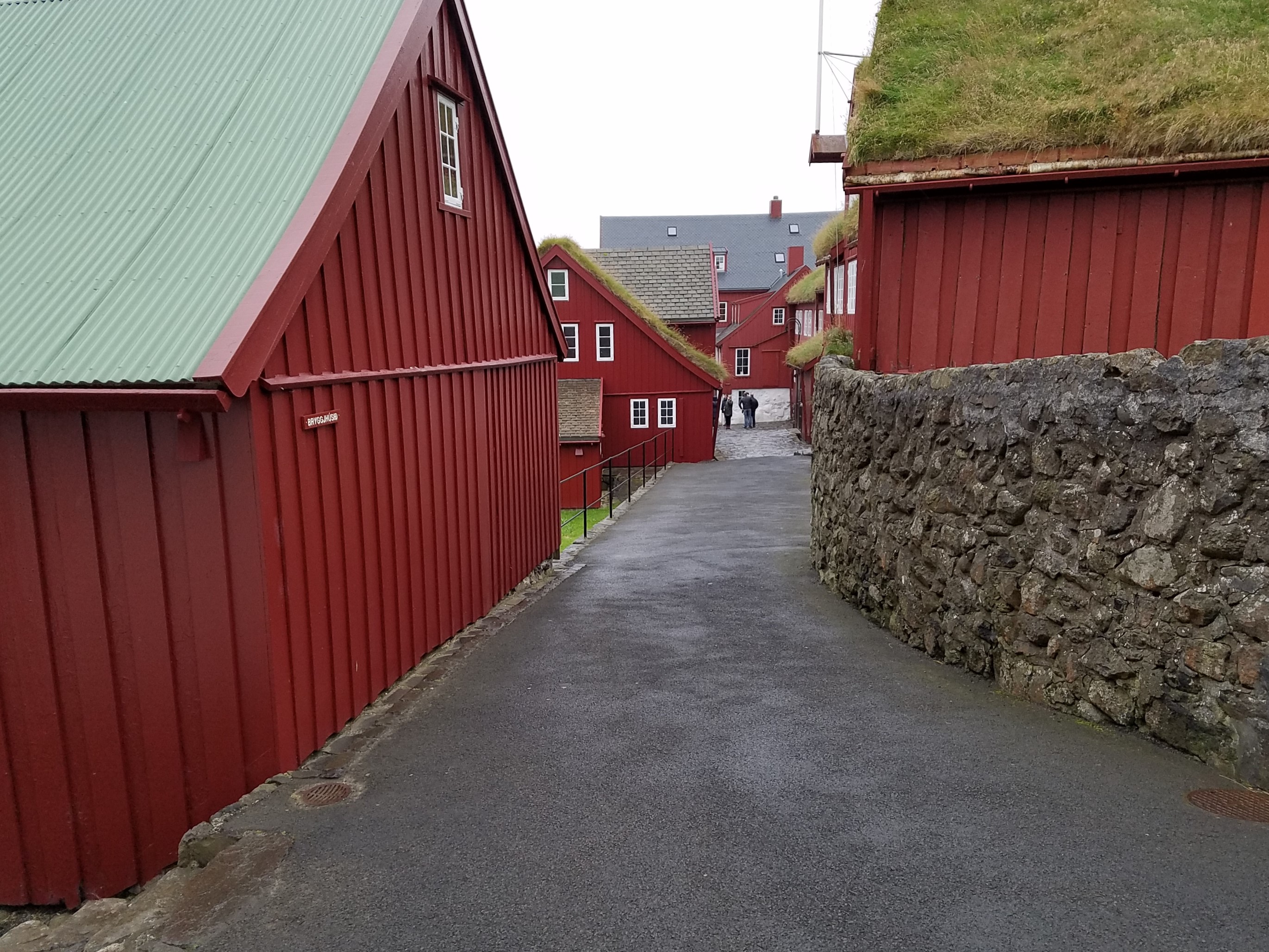 Early timber buildings have survived in the Tinganes area of Torshavn, which contains government offices and shops. Tinganes is the historic site of the Faroese landsstyri (government); the name means "parliament jetty" or "parliament point" in Faroese. 