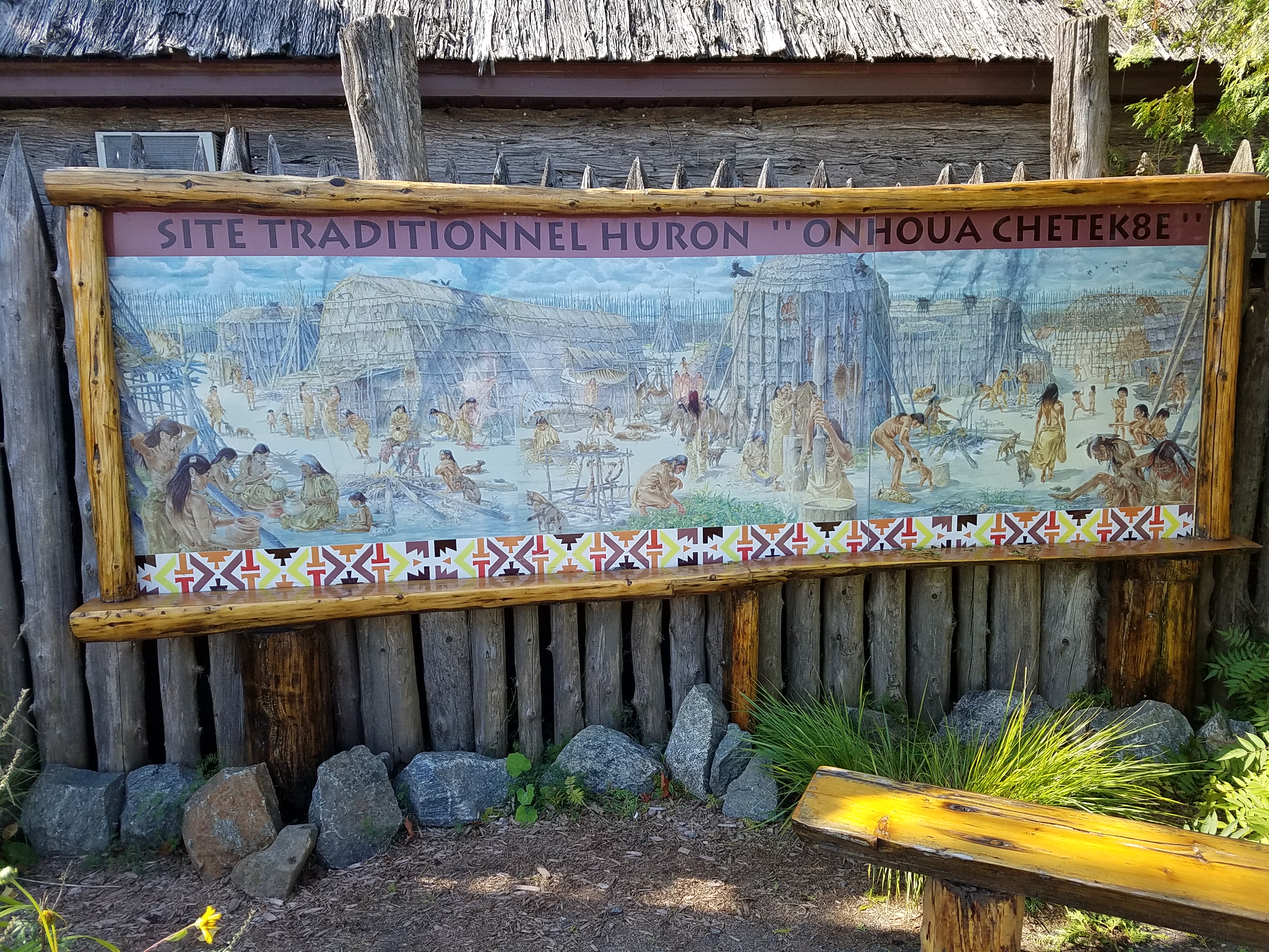Sign at Wendake, a 300-year-old community established by the Wendat (Huron) people northwest of  Quebec City. The reserve includes a replica Wendat village.