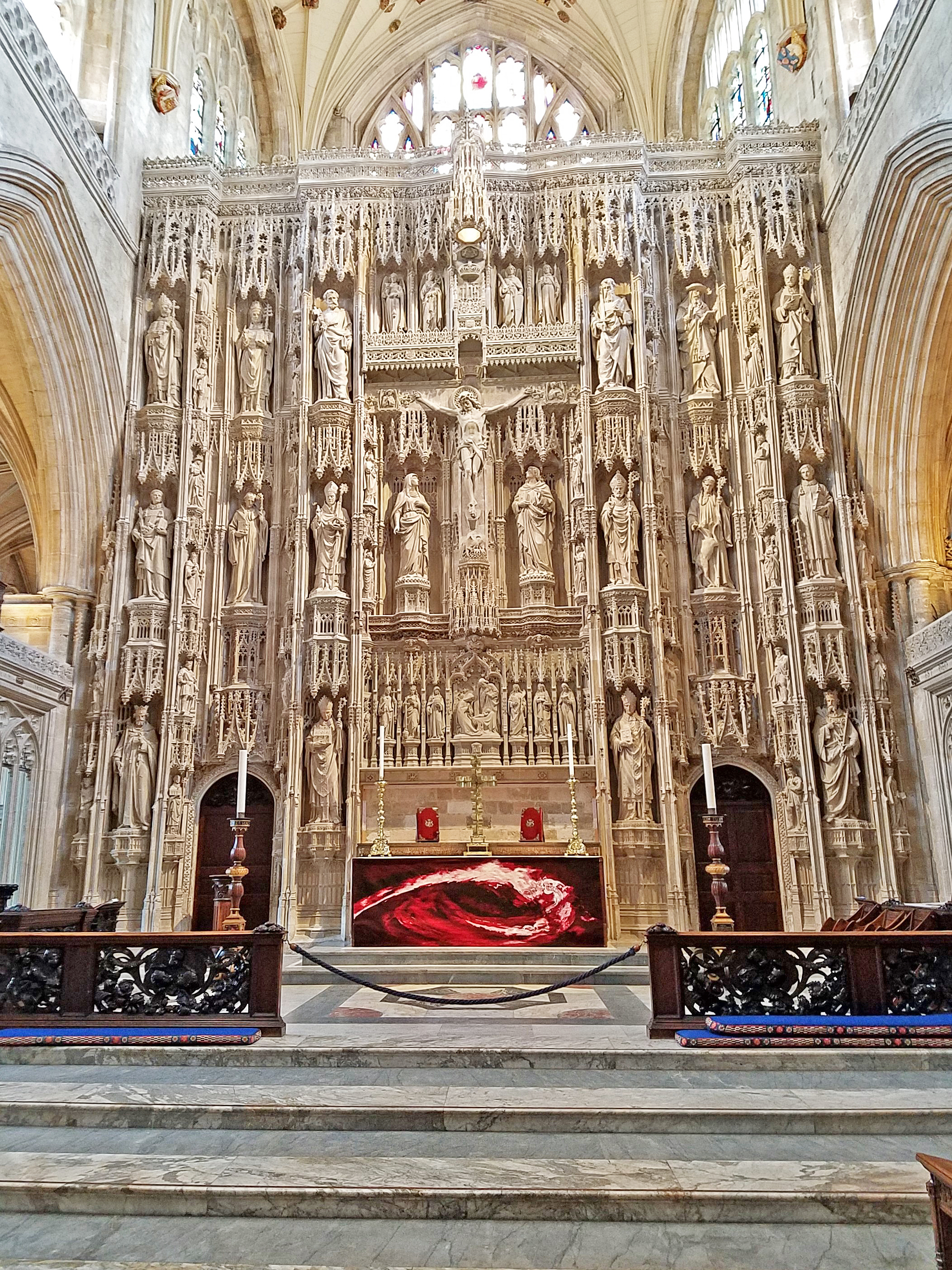 The High Altar of Winchester Cathedral features an ornate 15th-century stone screen. 