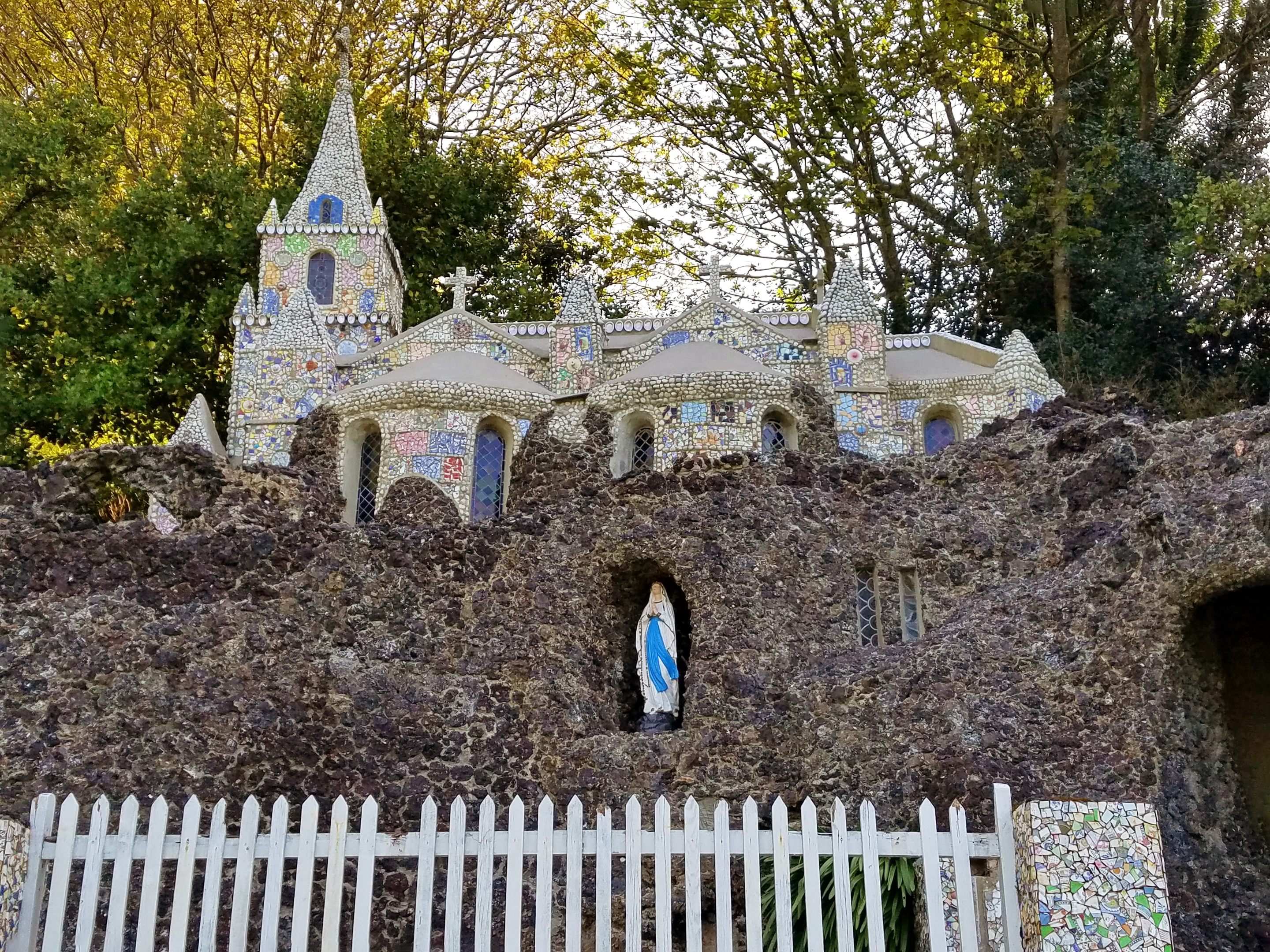 The Little Chapel in Guernsey was built in 1914 using donated pieces of china, seashells, and pebbles by a monk who wanted to create a miniature version of the Shrine of Our Lady at Lourdes (France).  Much of the broken china was donated by the Wedgewood and Royal Doulton companies. The chapel has room for about eight people and has been described as "probably the biggest tourist attraction in Guernsey."