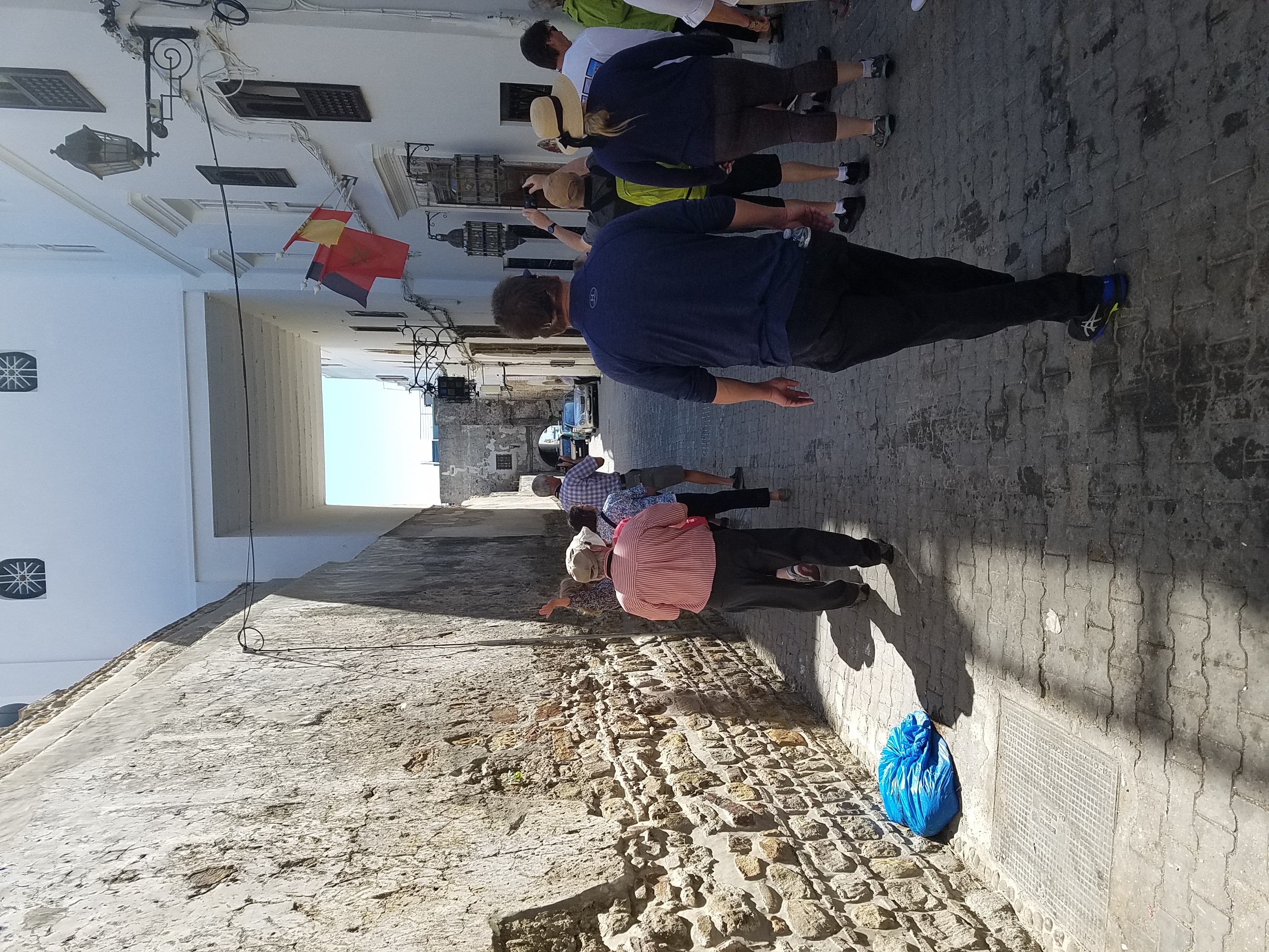 Narrow street in Tangier leading from the Kasbah.   In Morocco, the Arabic word "kasbah" refers to multiple buildings in a keep, a citadel, or several structures behind a defensive wall.
