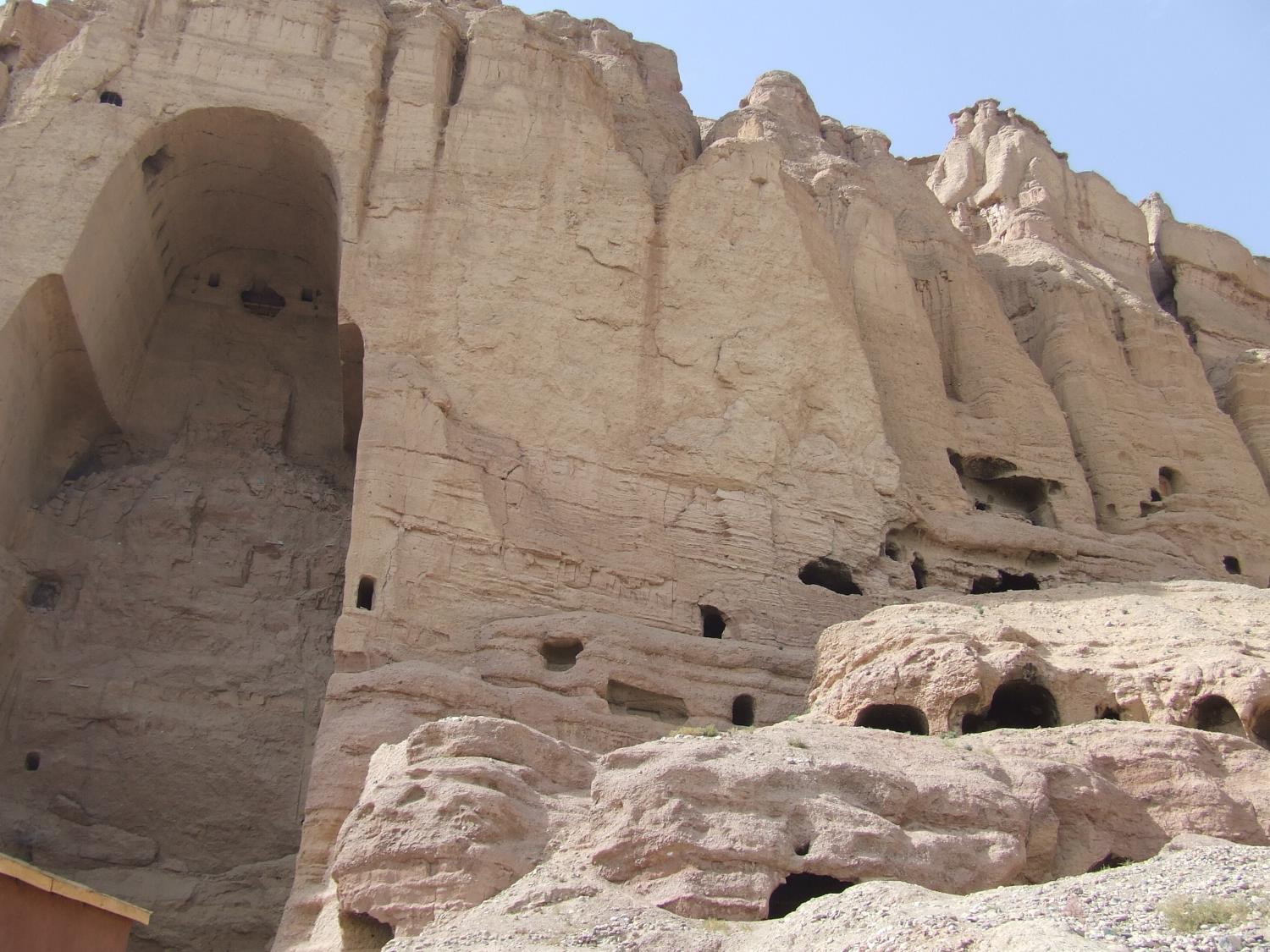 View of the shell of the "Large Buddha" and surrounding caves in Bamyan. The Buddha statue in this cave as well as in another - both dating to the sixth century A.D. - were frequently visited and described over the centuries by travelers on the Silk Road. Both statues were destroyed by the Taliban in 2001. 