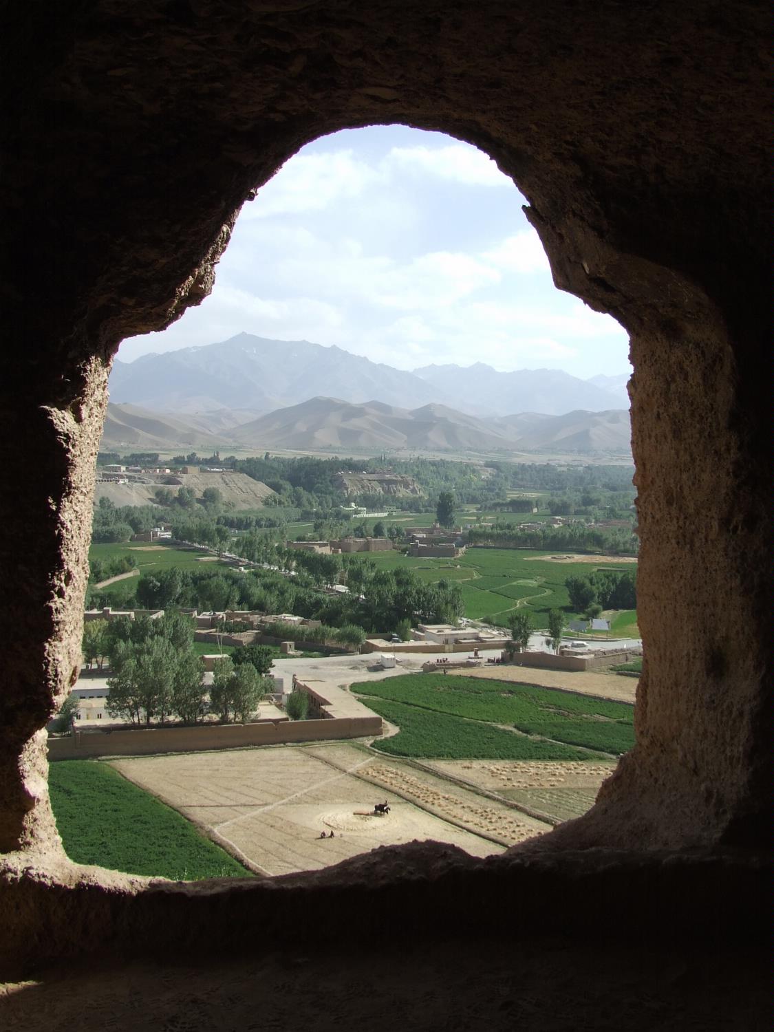 View of surrounding farmlands from within the caves at the "Large Buddha" in Bamyan. The caves were once inhabited by Buddhist monks who left behind a legacy of religious frescoes and paintings, partially destroyed by the fundamentalist Taliban.  