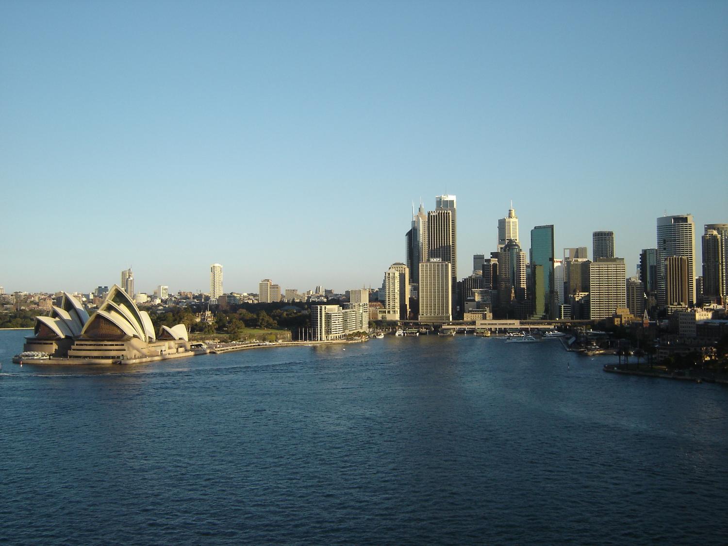 View of Sydney's Harbor and skyline, including the famous Opera House.
