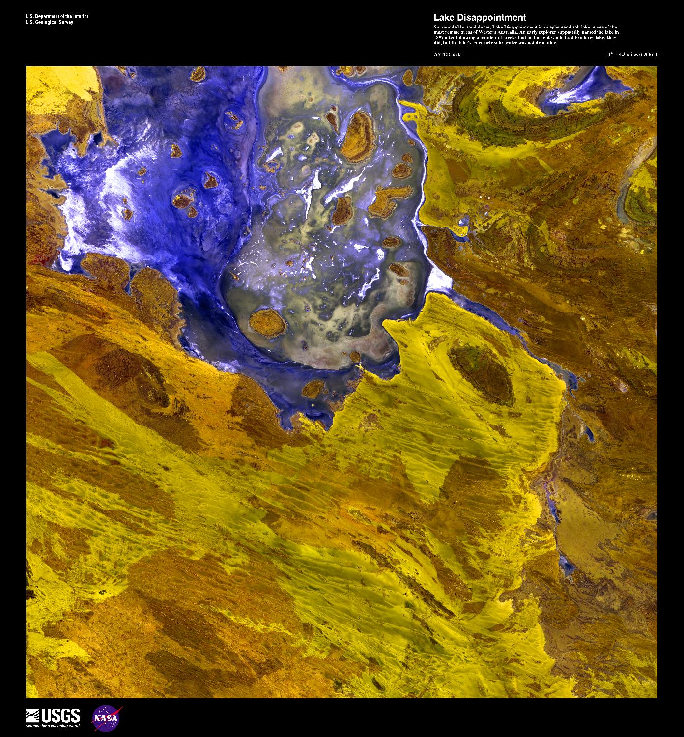 A false-color satellite image  of Lake Disappointment, an ephemeral salt lake surrounded by sand dunes in one of the most remote areas of Western Australia. An early explorer supposedly named the lake in 1897 after following a number of creeks that he thought would lead to a large lake; they did, but the lake's extremely salty water was not drinkable. Image courtesy of USGS.