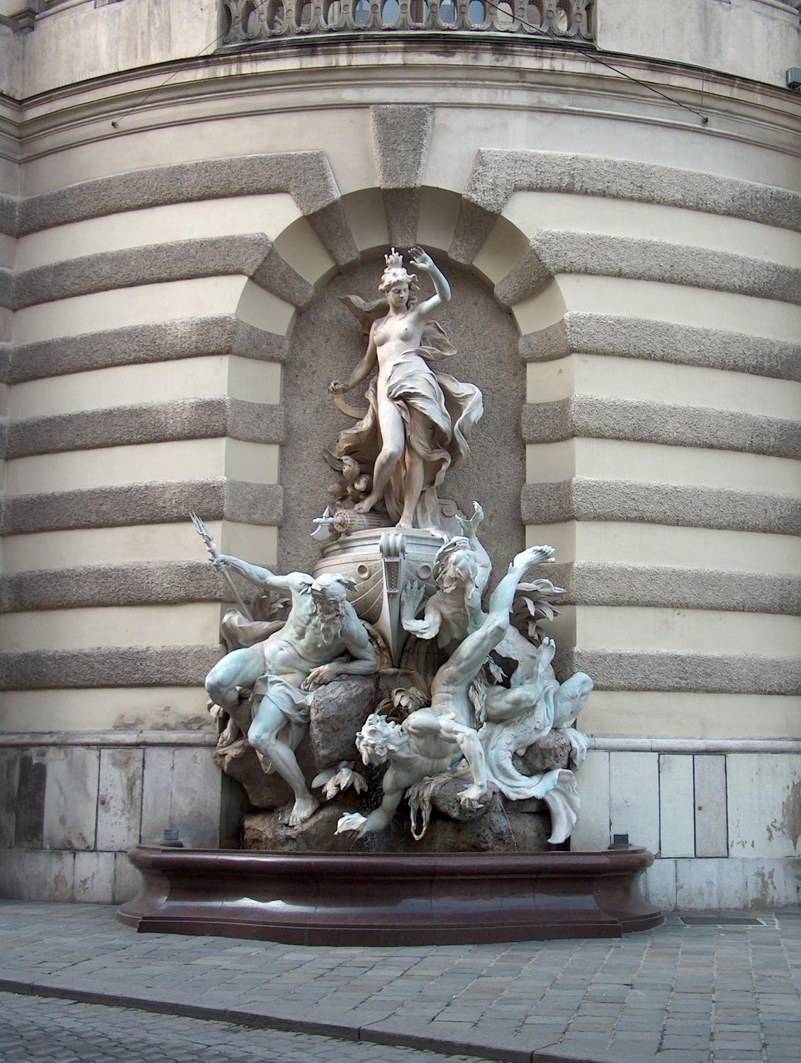 The fountain, Power at Sea, one of two that grace the front of the Michaelertrakt (Michael's Wing) of the Hofburg (Imperial Palace) in Vienna. 