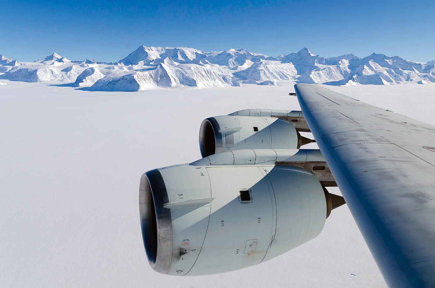 NASA's DC-8 flying laboratory passes Antarctica&amp;apos;s tallest peak, Vinson Massif, on 22 October 2012, during a flight over the continent to measure changes in the massive ice sheet and sea ice. The flight was part of NASA&amp;apos;s Operation IceBridge, a multi-year airborne campaign to monitor changes in Earth&amp;apos;s polar ice caps in both the Antarctic and Arctic. Vinson Massif is located in the Sentinel Range of the Ellsworth Mountains in Antarctica. Photo courtesy of NASA/Michael Studinger.

