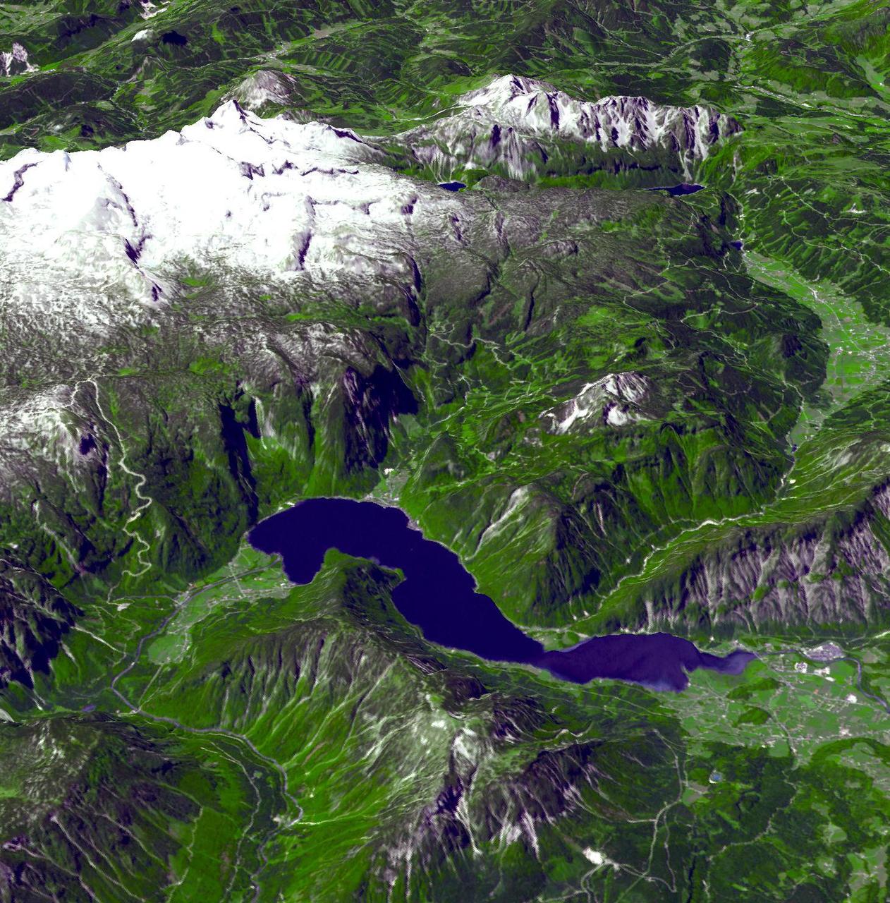This perspective view from the ASTER instrument aboard the NASA Terra spacecraft shows some of the magnificent natural landscape of the Austrian Salzkammergut region - renowned for its mountains and lakes. North is to the right and Hallstadt lies near the "top" (southwest) where the lake narrows, tucked into the lake shore. Image courtesy of NASA. 