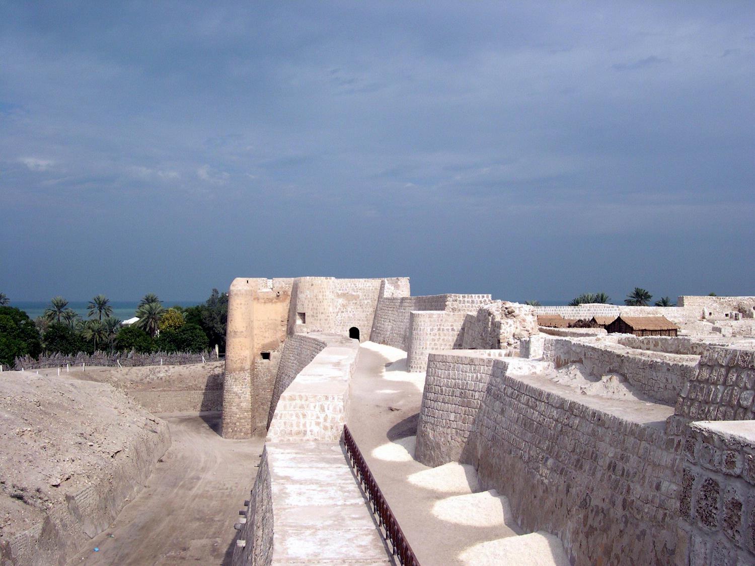 Walls of the historic Qal'at al-Bahrain (Fortress of Bahrain), which is the largest and most ancient historical site in the country. It was an important center of the Dilmun Civilization (2nd and 1st millennia B.C.); in later periods, it served as a trading and military outpost.