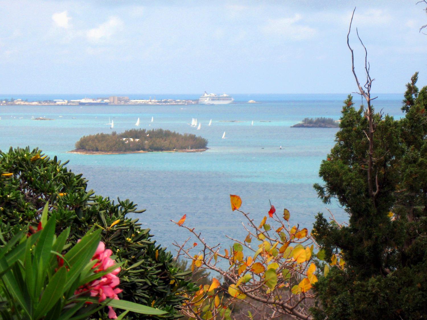 The view east toward King's Wharf from Gibbs Hill with sailboats and cruise ship in the distance.
