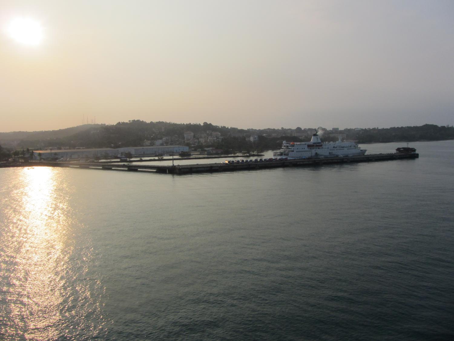 Sihanoukville, part of which is seen here at sunrise, is a major port in Cambodia and a growing beach resort. It was called Kampong Saom during the time of the Khmer Rouge. Construction on the port began in 1955 at the direction of King Norodom SIHANOUK after Vietnam began to restrict Cambodian access to ports in that country. The deep-water port, which opened in 1960, lies on the Gulf of Thailand about 185 km (115 mi) south of the capital at Phnom Penh. 