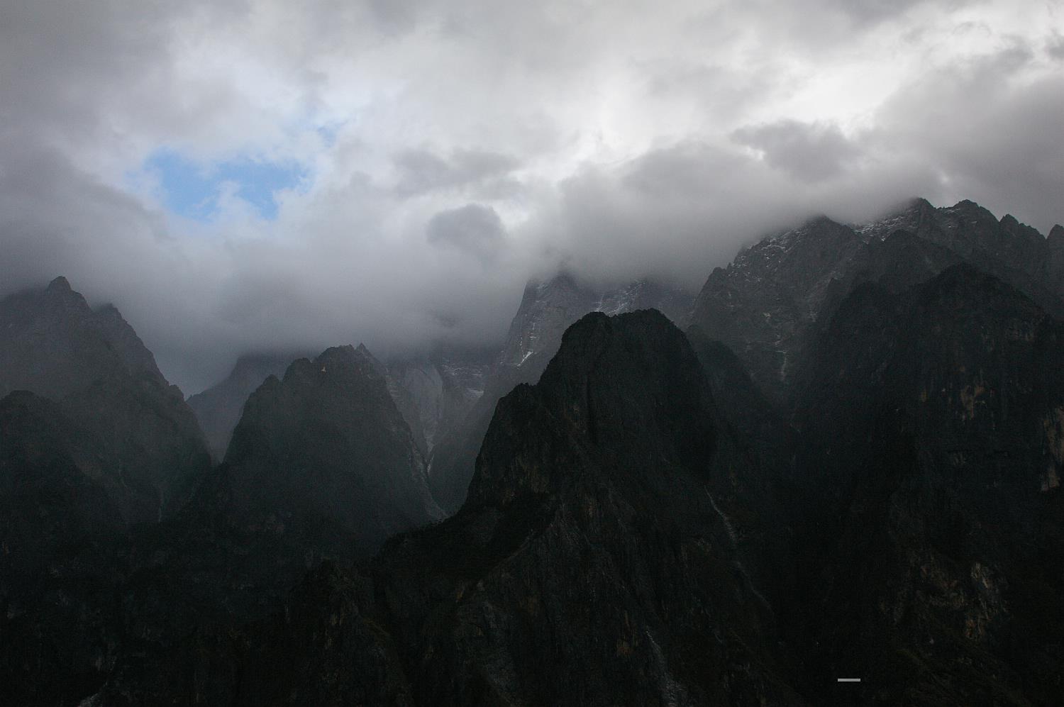 Tiger Leaping Gorge, one of the world's deepest river canyons, is located on the Yangtze River near Lijiang City, Yunnan. A local legend of a tiger that leapt across the narrowest point of the gorge gives the site its name.