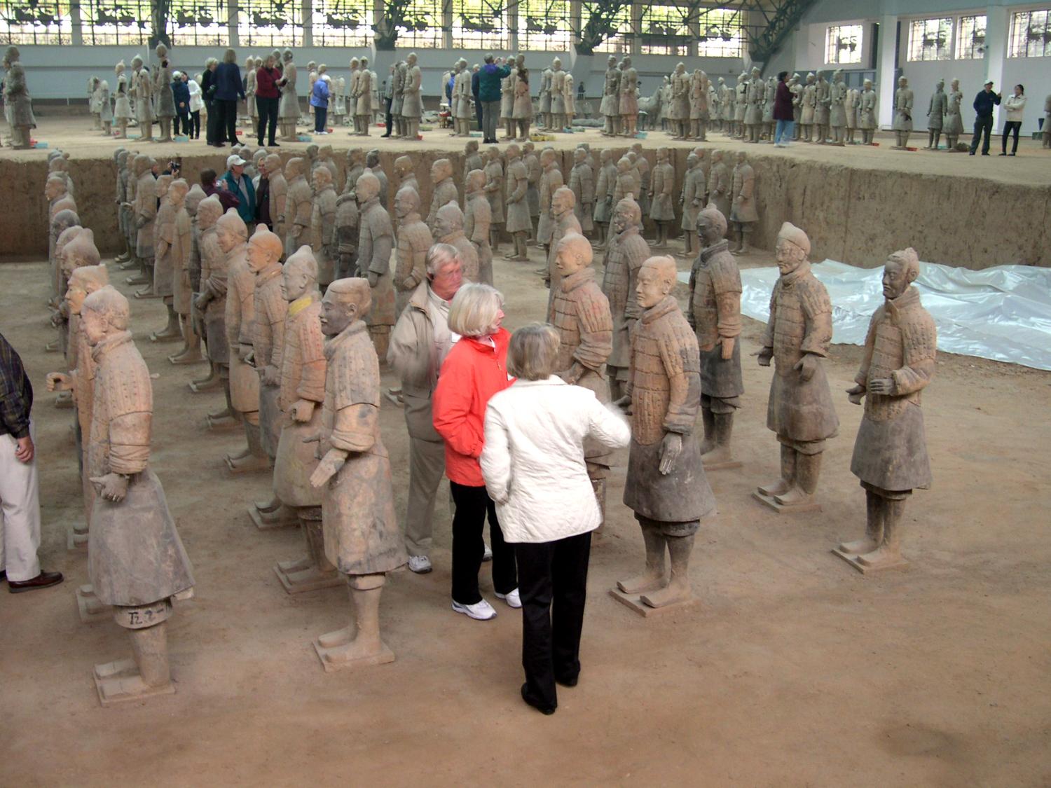 Some of the terra cotta warriors found in the mausoleum of the first Chinese Emperor Qin Shi Huang (221-210 B.C.) in Xi'an. The tomb, under an earthen pyramid, was discovered in 1974 and excavations are ongoing. The ceramic army that accompanied the ruler into the afterlife is estimated to consist of over 8,000 soldiers (each with a unique face), 100 chariots with 400 horses, and 300 cavalry horses. 