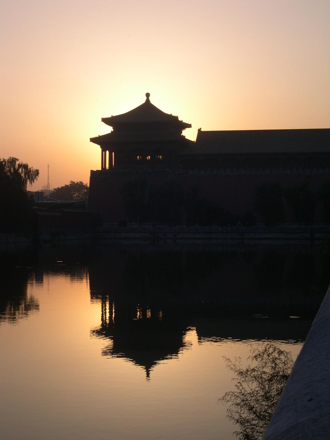 A section of the Forbidden City in Beijing at sunset. Built between 1406 and 1420, the palace complex served as the Chinese imperial palace until 1912. Today it is the Palace Museum showing artifacts from the Ming to the Qing Dynasties (14th to 20th centuries). The complex - on the World Heritage Site list since 1987 - consists of 980 surviving buildings on 72 hectares (178 acres) and is the largest collection of preserved ancient wooden structures in the world. 