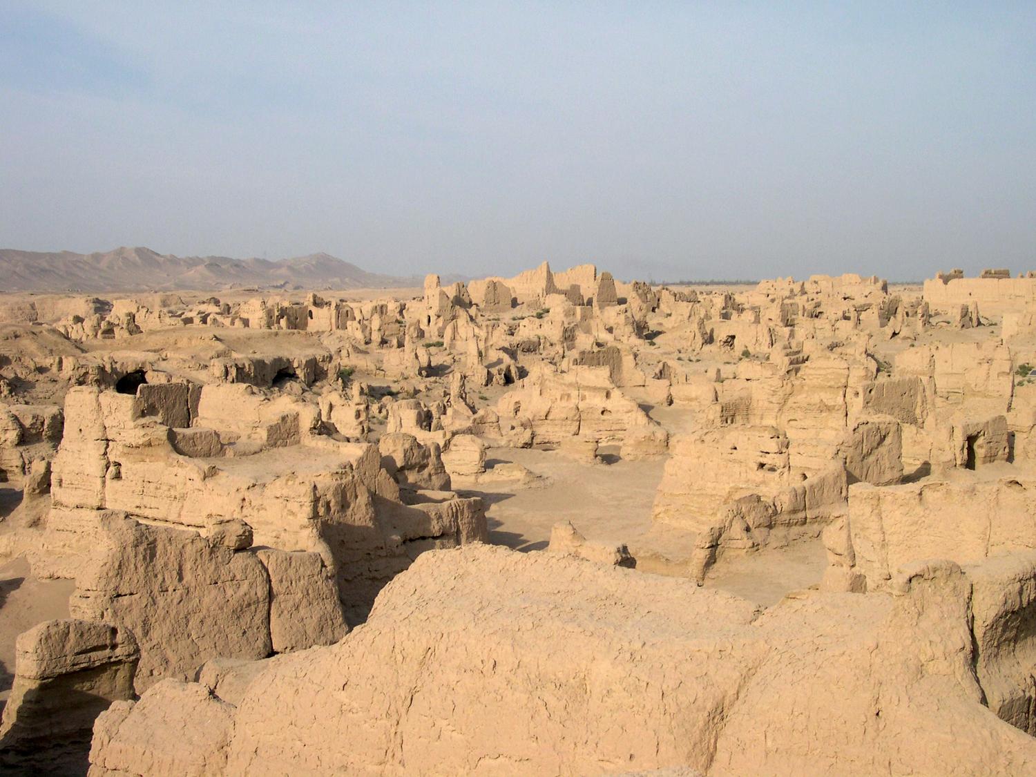 The ruins of Jiaohe in the Yarnaz Valley 10 km (6 mi) west of Turpan. An important site along the Silk Road, the city was situated on an islet in the middle of a river, which served as a natural barrier and enabled the city to be built without walls. From 108 B.C. to A.D. 450 it was the capital of the Anterior Jushi Kingdom; later, it became a prefecture capital until it was destroyed by the Mongols in the 13th century.