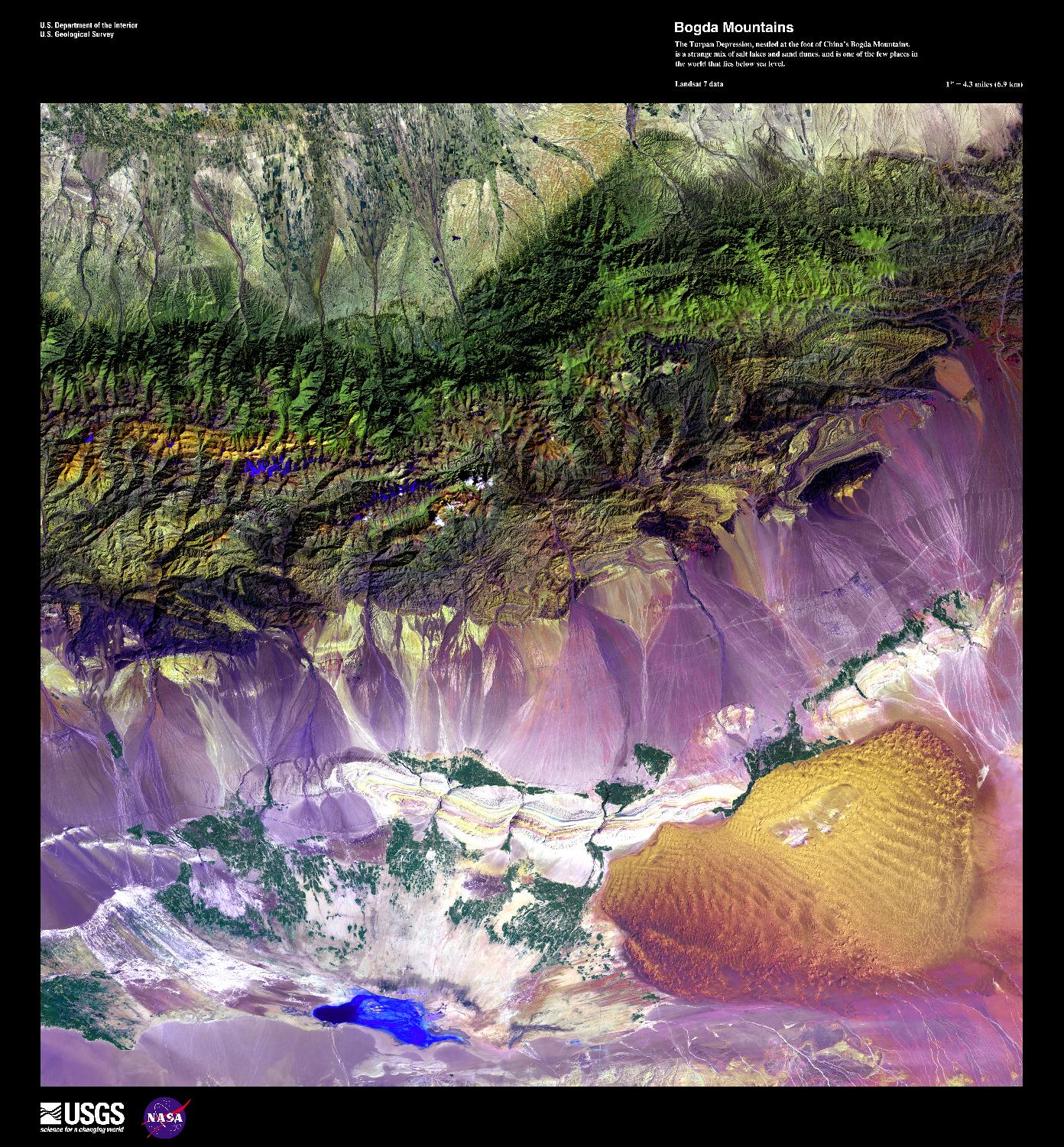 This false-color, high-resolution satellite photo shows the Turpan Depression, nestled at the foot of China's Bogda Mountains, south of the oasis city of Turpan. A strange mix of salt lakes and sand dunes, this fault-bounded trough is the lowest exposed surface in China. At the center of the basin lies Ayding Lake (bottom left), which is the third lowest exposed point on the earth's surface at -154 m (-505 ft). Image courtesy of USGS.