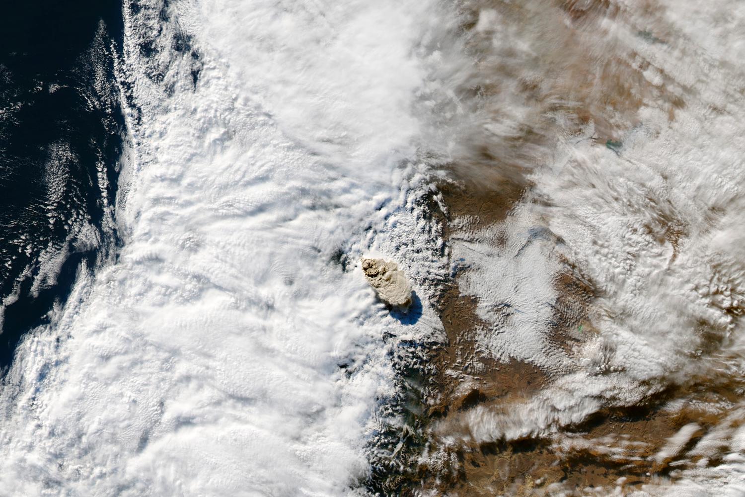 A volcanic ash cloud rises above Chile's Puyehue-Cordon Caulle volcano shortly after its eruption on 4 June 2011. Soon after this image was taken, the ash quickly blew eastward towards Argentina. Over the border, near the town of Bariloche, a layer of ash at least 30 cm (12 in) deep covered the ground.
Image courtesy of NASA.