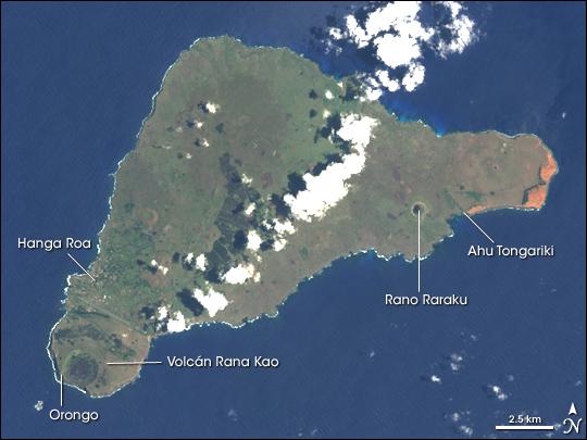Discovered by Dutch sailors on Easter Sunday 1722 and named for the holy day, the isolated Pacific island had already been inhabited for more than one thousand years, most likely settled by Polynesian sailors in canoes between A.D. 400 and 700. The most amazing cultural artifacts on display were giant stone statues, called moai, resting on ahu, raised platforms of expertly fitted stones. Most of the hundreds of moai on the island were carved out of volcanic rock in the crater of Rano Raraku, located in the southeastern part of the island. In addition to the many moai scattered around the coast of the island, Rano Raraku is littered with moai, some only half-carved, others that appear to have broken in the attempt to remove them from the quarry, and still others that seem to simply have been abandoned. East of Rano Raraku is Ahu Tongariki, where in 1960 a tidal wave caused by an earthquake in Chile struck the southern coastline and swept 15 moai inland for several hundred feet. In 1992, the site was restored by a Chilean archeologist. On the western end of the island is the only town, Hanga Roa, where most of Rapa Nui's 2,000 residents live. South of the town is the island's largest volcanic crater, Rana Kao. Along the crater rim looking southward over the coast, lie the ruins of Orongo, a ceremonial site containing elaborate stone carvings and other artwork. Landsat image courtesy of NASA.