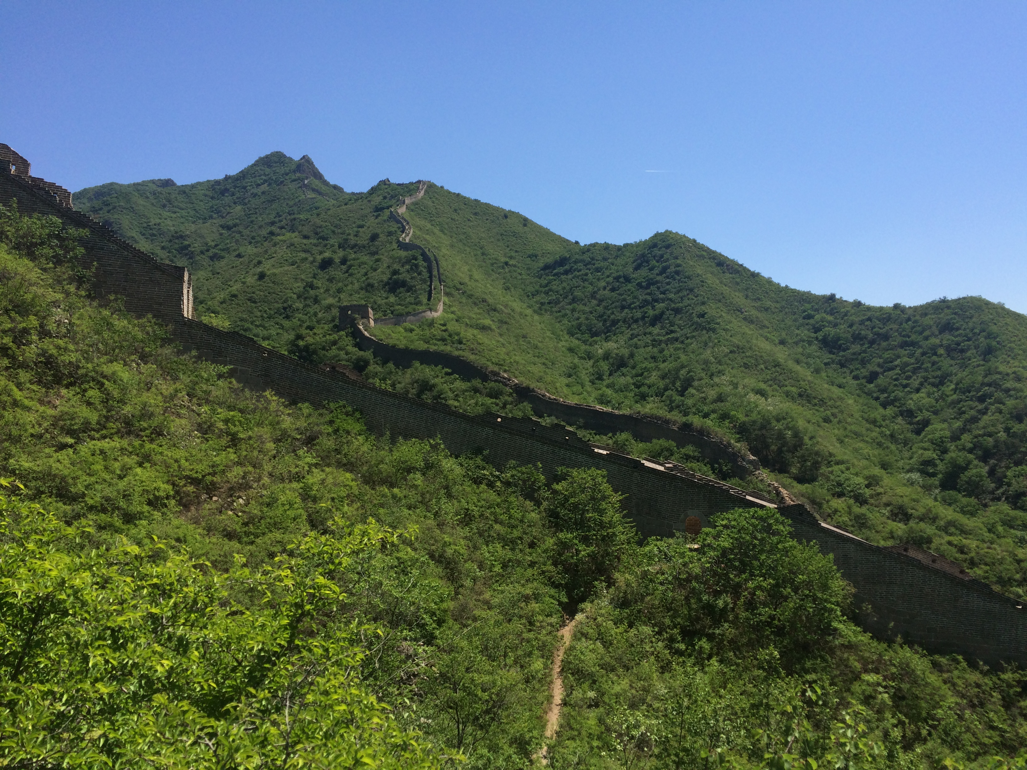The Huanghuacheng (Lakeside) section of the Great Wall derives its name from the nearby man-made reservoir lakes. Unlike the main tourist sections of the Great Wall at Mutianyu and Badaling, the Lakeside Great Wall draws a far smaller number of tourists. The section features appealing sights including submerged parts of the Great Wall under the lake water and a sweeping view after a steep hike to a high guard tower.