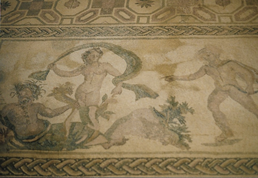 The Apollo and Daphne mosaic the House of Dionysos at the Archeological Park at Paphos. The seated figure is Peneus, the father of Daphne. The Paphos Park is a UNESCO World Heritage site. 