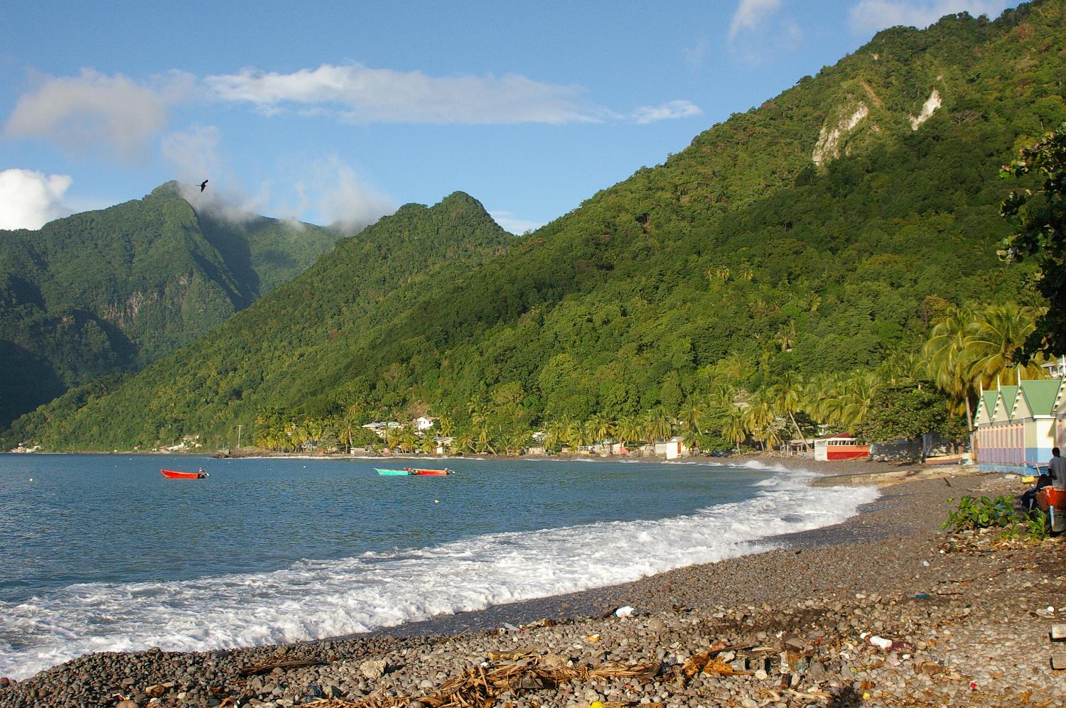View of the south side of the island. Dominica features lush mountainous rain forests, and is the home of many rare plant, animal, and bird species (including the Sisserou Parrot featured on its flag). 