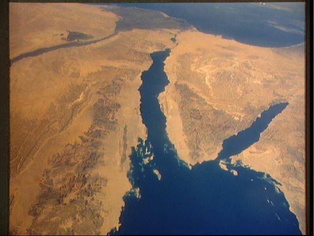A panoramic view of the entire Sinai Peninsula and the nearby Nile River Delta and eastern Mediterranean coastal region. The Suez Canal, at the top of the scene just to the right of the Delta, connects the Mediterranean Sea with the Gulf of Suez. The water body to the right of the peninsula is the Gulf of Aqaba. Click on photo for higher resolution. Image courtesy of NASA. 