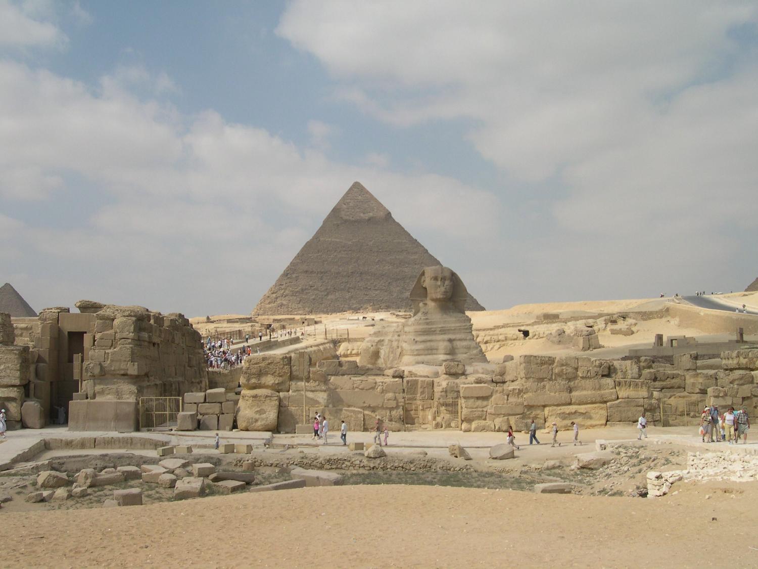 This photo shows a number of the ruins at Giza. To the left is the Valley Temple with a causeway stretching to the Pyramid of Khafre. The Great Sphinx lies before the Pyramid and the remains of the Temple of the Sphinx lie in front of the sphinx itself.