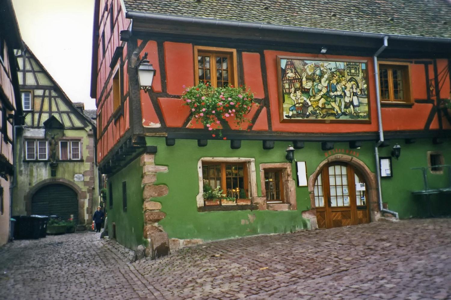Colorful house in the medieval Alsatian town of Riquewihr. The locale is renowned not only for its historic architecture, but also for the fine wines it produces.