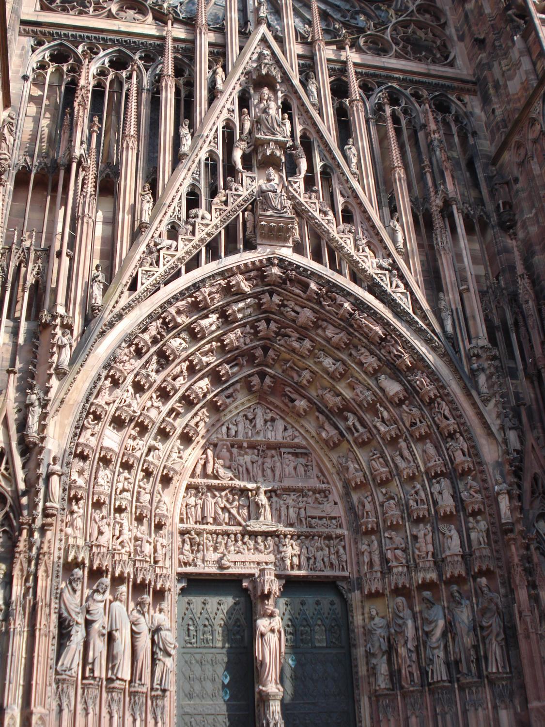 The famous west portal of the Strasbourg Cathedral is in the Gothic style and has hundreds of figures sculpted into it.