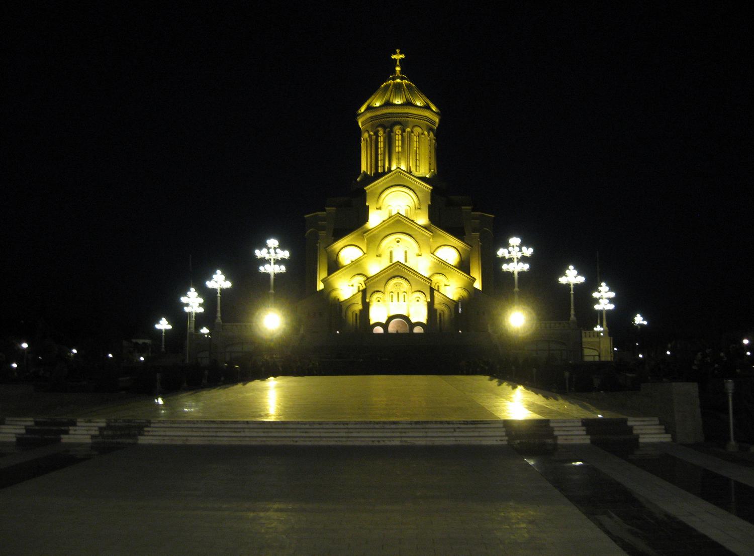 The Sameba (Holy Trinity) Cathedral  in Tbilisi, is the main Georgian Orthodox Christian cathedral. It was built between 1995 and 2004 as a symbol of Georgian national and spiritual revival. The cathedral, located on the left bank of the Mtkvari River in Old Tbilisi, is cruciform and contains nine chapels. The Sameba complex also includes various other religious buildings. 
