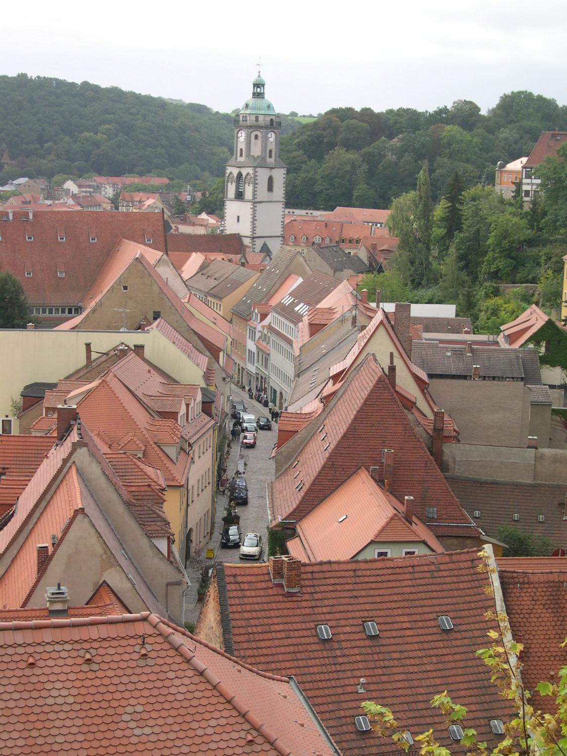 Looking down on the roofs of Meissen with the Church of Our Lady in the background. The Gothic church, located next to Market Square, was built between 1460 and 1570 and was the first to have tunable chimes of porcelain bells in its tower.