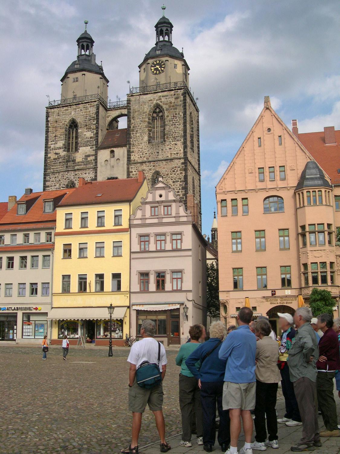 The Market Place of Wittenberg with the Stadt Kirche (City Church) - also known as Marienskirche (St. Mary's Church) or Mother Church of the Reformation - in the background. Luther did most of his preaching in the church, some parts of which date to the 13th century. 