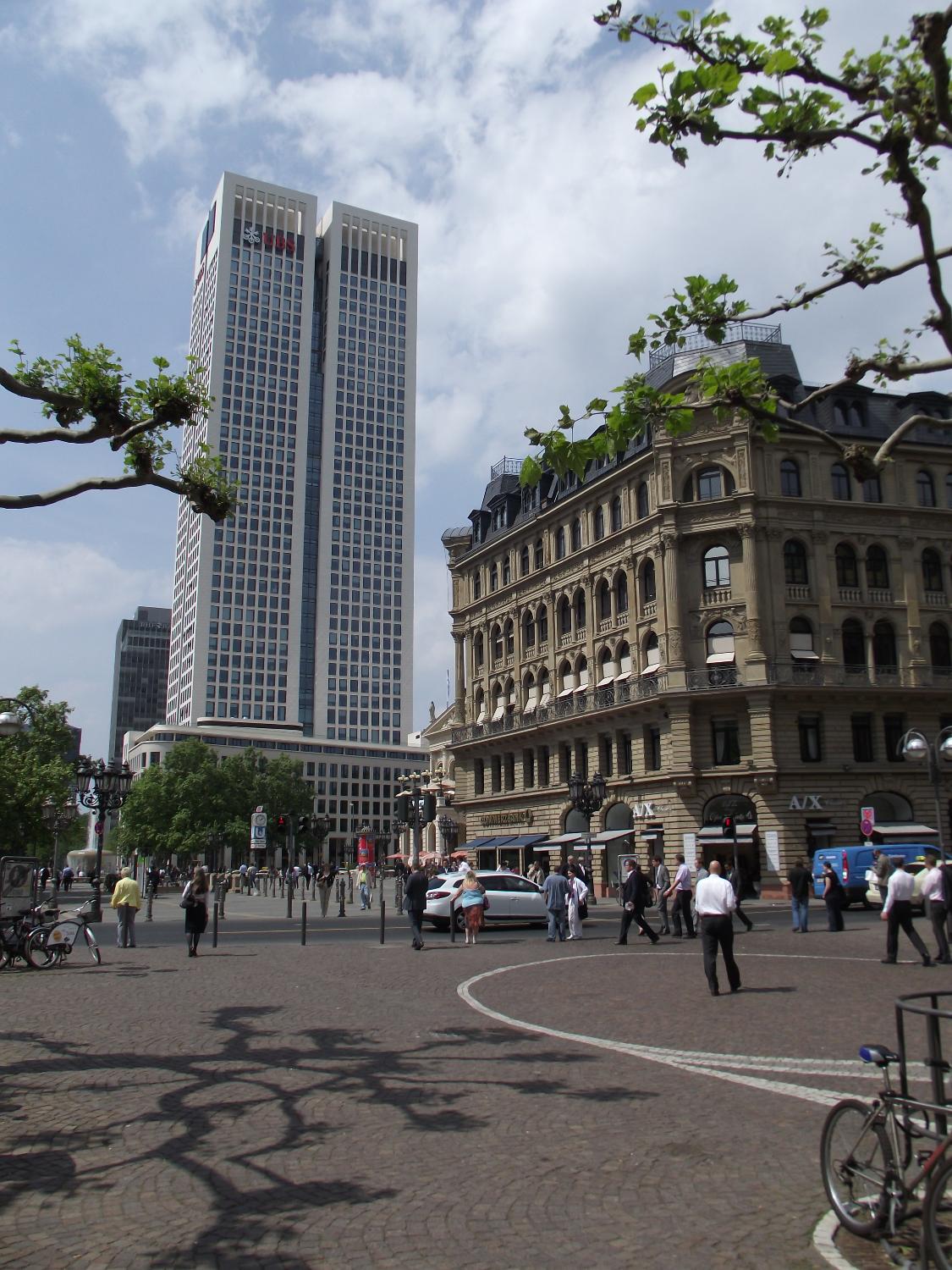 The Operturm (Opera Tower) in Frankfurt was opened in 2010 and is named after the Alte Oper (Old Opera House) that it faces, a corner of which may be glimpsed in the very center of the photo.