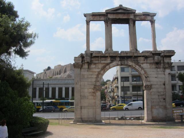 Hadrian's Arch in downtown Athens was built in A.D. 131 or 132 to honor the Roman Emperor Hadrian, possibly for restoring much of the city and completing the nearby Temple of Olympian Zeus. The Parthenon and Acropolis can be seen in the left background. 