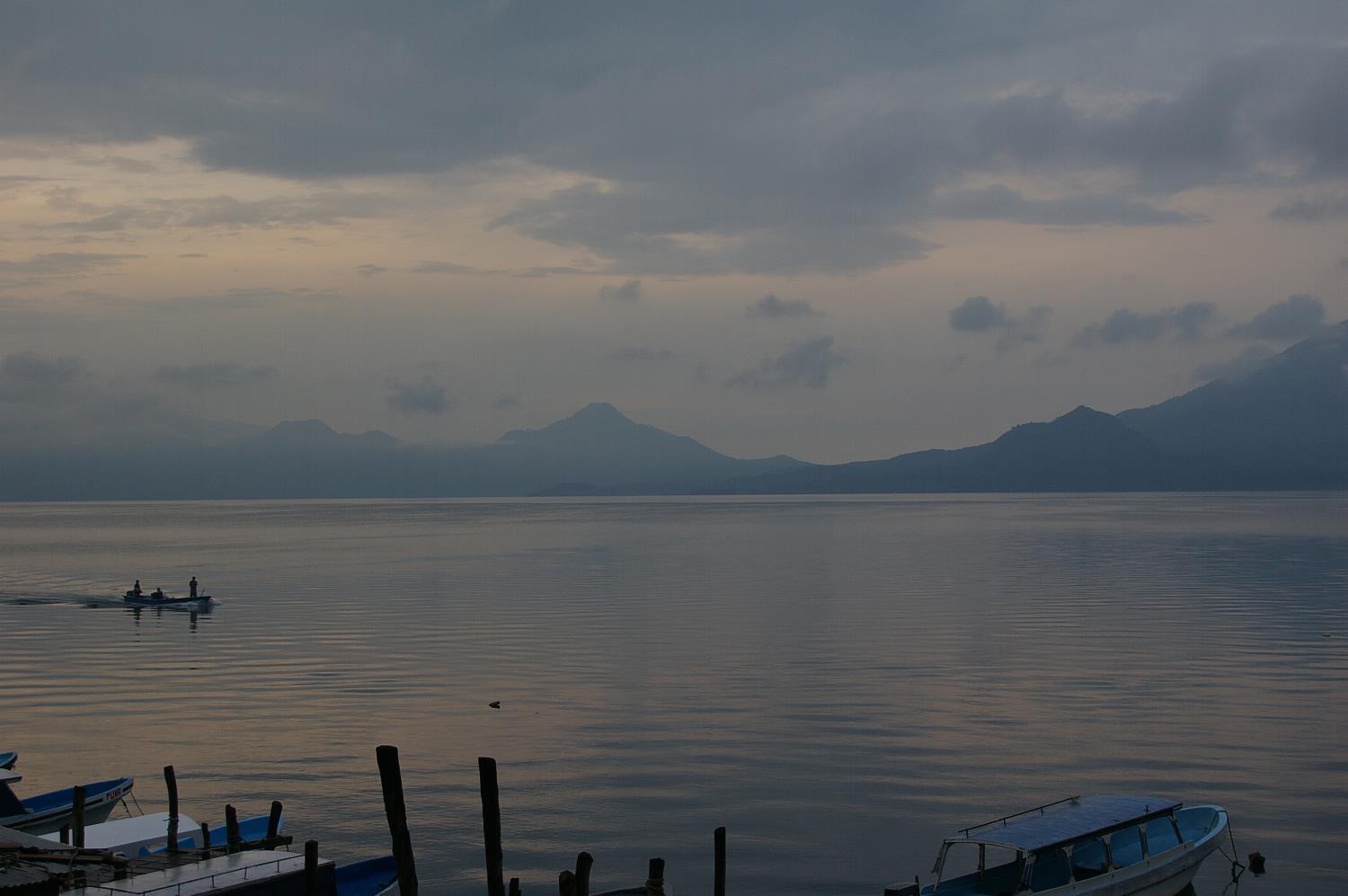 The volcanic Lake Atitlan at sunrise, as the fishermen begin their day.