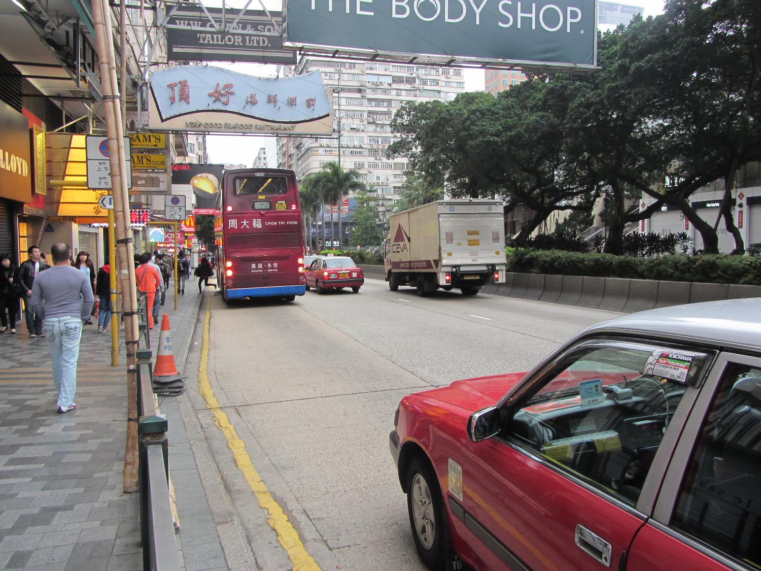 A street scene on Nathan Road in downtown Kowloon in Hong Kong. Double-decker buses are popular.
