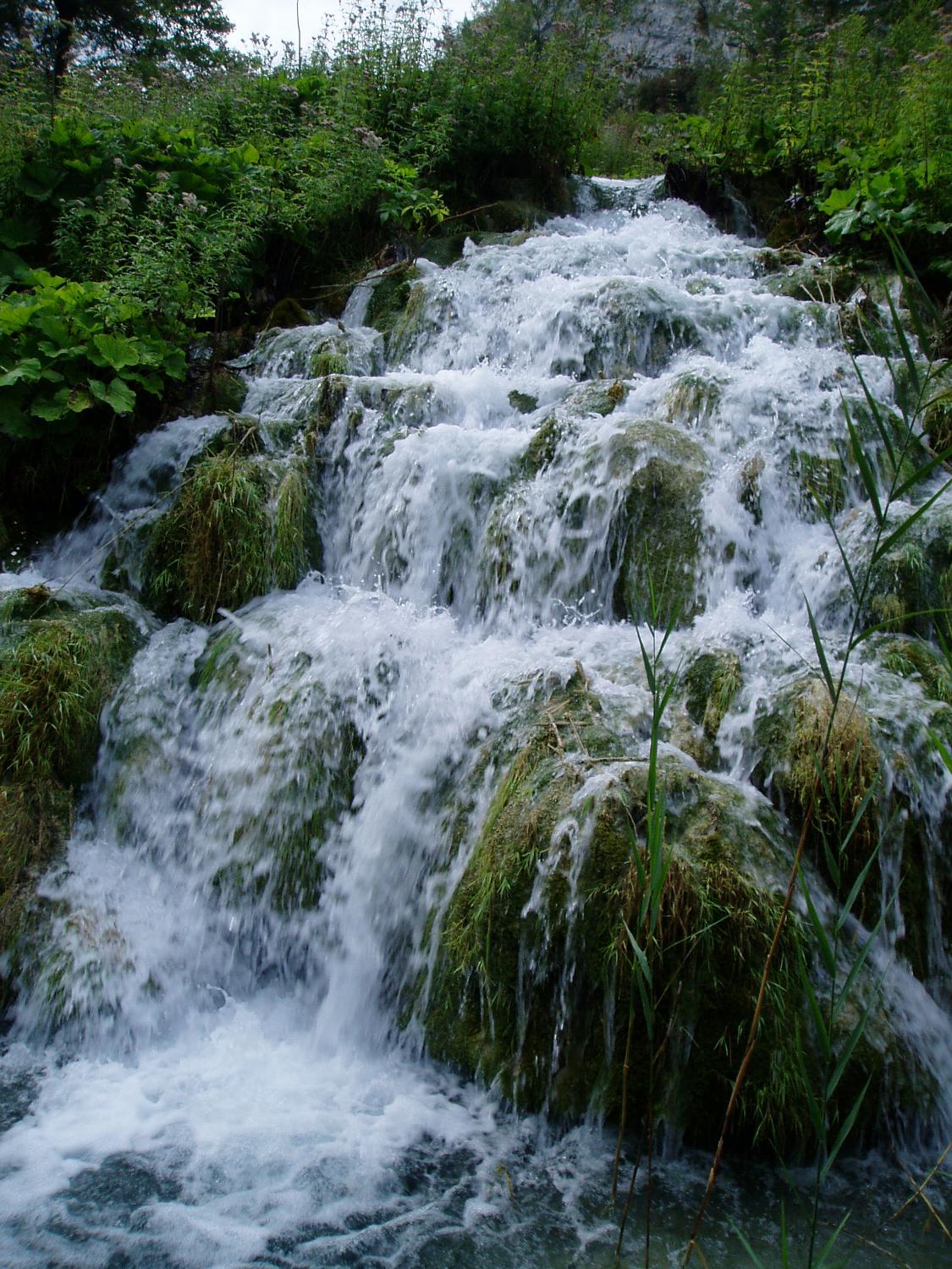 Close up of waterfalls in Plitvice Lakes National Park. The park is the largest and most popular of the eight national parks in Croatia and consists of 16 lakes linked but separated by natural dams.