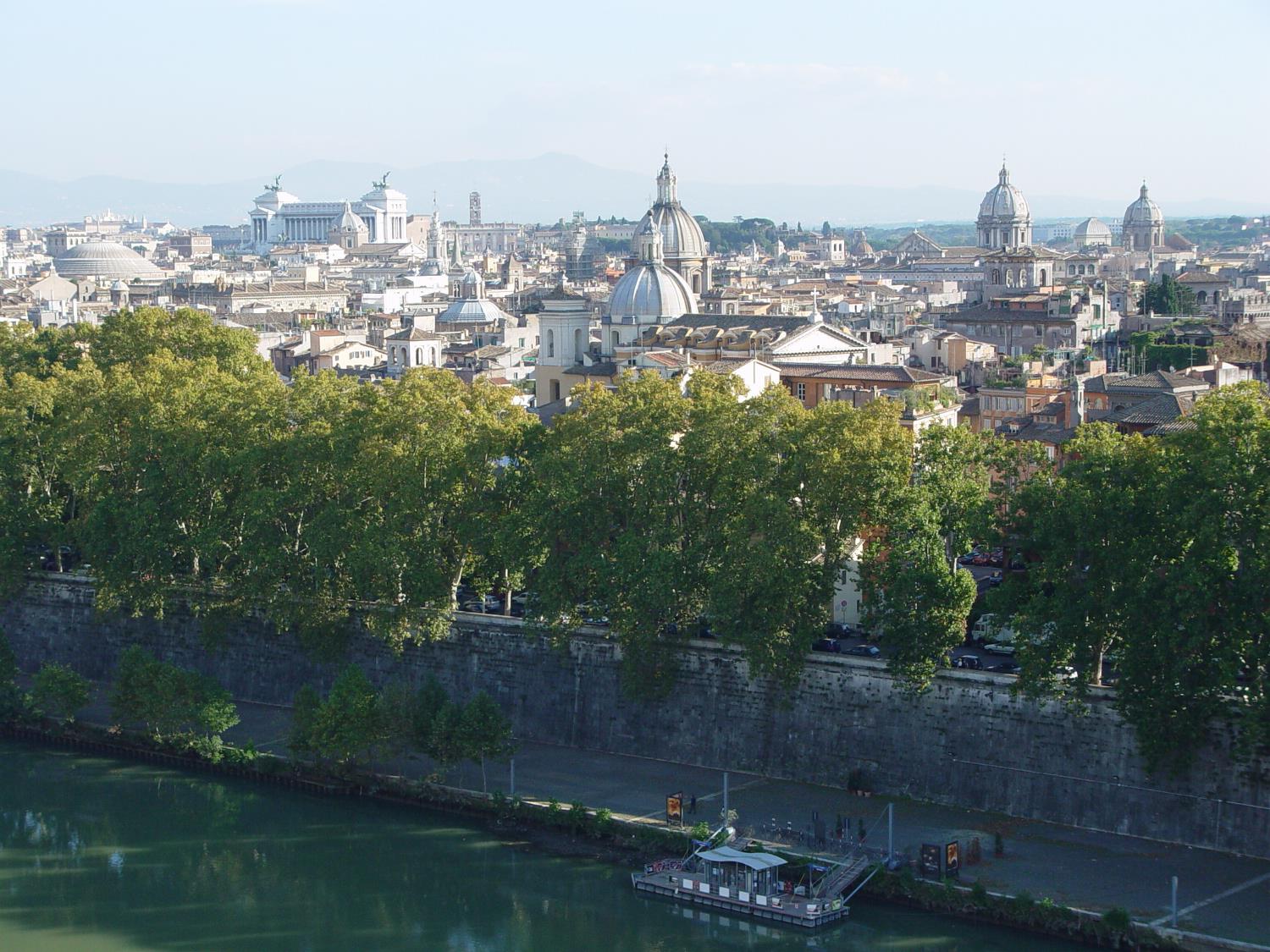 The ancient and historic city of Rome, showing the dome of the Pantheon on the left, the Monument of Victor Emanuel II in the left background, and various church domes.