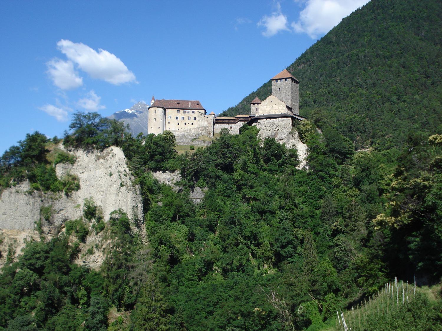 The building of Castle Tyrol began in the 11th century; further construction took place during the following two centuries. The fortress was the residence of the Counts of Tyrol until 1363 when the Hapsburgs took possession. It is now home to the South Tyrol Museum of History, and is also known for its castle chapel frescoes and two distinctive Romanesque portals.