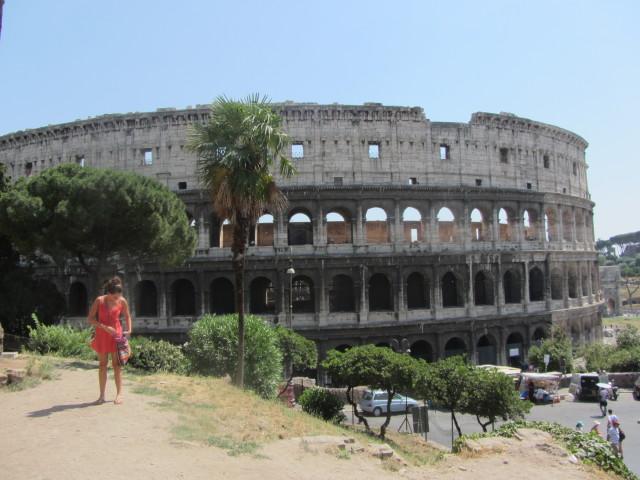 The Colosseum in Rome was first used in A.D. 80.  In Roman times, it was called the Flavian Amphitheater and held 50,000 spectators. The name "Colosseum" was introduce in medieval times and referred to a giant statue of Nero that stood nearby.  The outer walls have three levels of arches with columns topped by Ionic capitals at the lower level and Doric and Corinthian at the top. The 80 entrance/exit arches, known as vomitoria, allowed spectators easy access and the ability to clear the building in minutes.