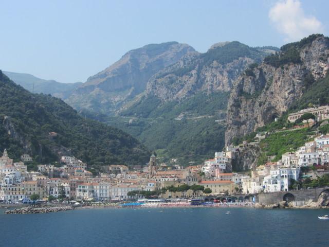 View of the city of Amalfi with Mount Cerreto (1,315 m; 4,314 ft) in the background. Amalfi was a maritime power with 70,000 residents until 1343 when an earthquake and subsequent tsunami caused most of the city and population to fall into the sea and destroyed the port. The tower of the Amalfi Cathedral (Duomo di Amalfi), built in 1208 and named Saint Andrew's Cathedral, may be seen in the foreground.