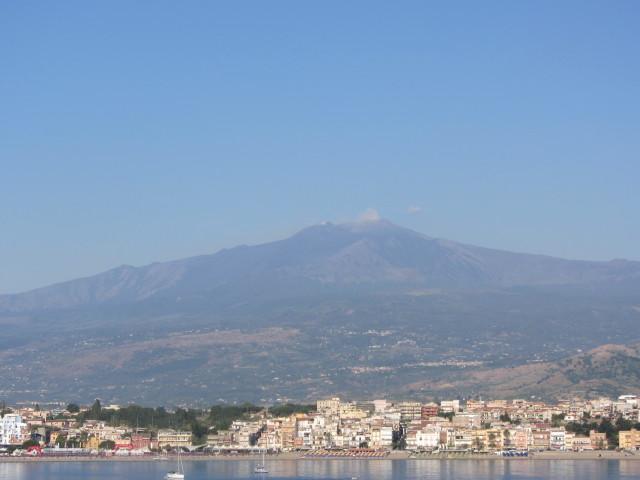 The city of Naxos in Sicily lies at the foot of Mount Etna. The resort city of Taormina is 7 km (4.5 mi) in the distance.

