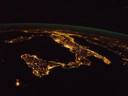 The "boot" of Italy is visible running diagonally southward from the horizon across the center of the frame, with the night lights of Rome and Naples being visible on the coast near the center. Sardinia and Corsica are just above left center of the photo, and Sicily is at lower left. The Adriatic Sea is on the other side of Italy, and beyond it to the east and north can be seen parts of several other European nations. Image courtesy of NASA.