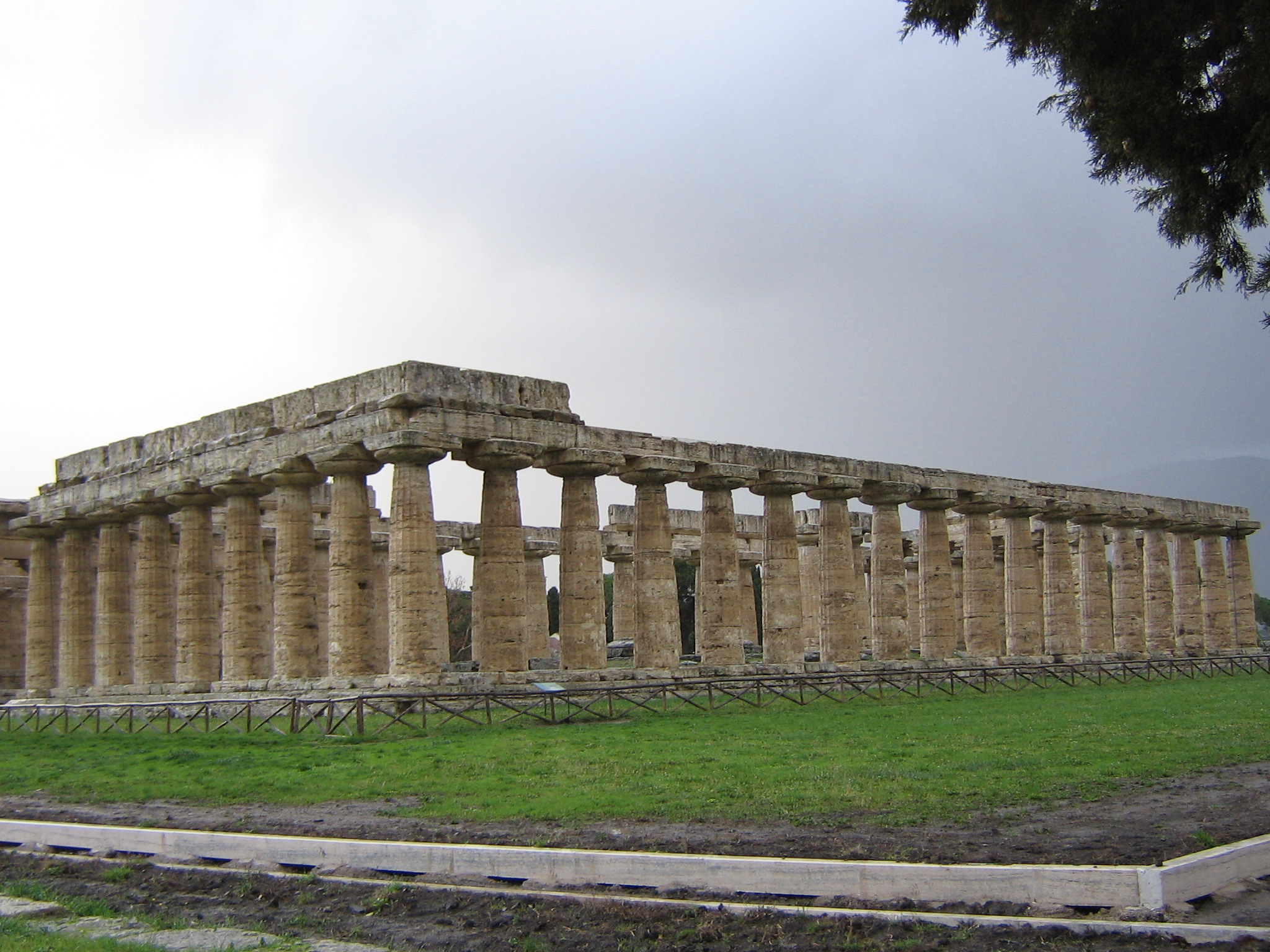 The First Greek Temple of Hera at Paestum in southern Italy. Paestum was a major ancient Greek city on the coast of the Tyrrhenian Sea in Magna Graecia (southern Italy). The ruins of Paestum are famous for their well-preserved ancient Greek temples - including two dedicated to Hera - dating from about 550 to 450 B.C.