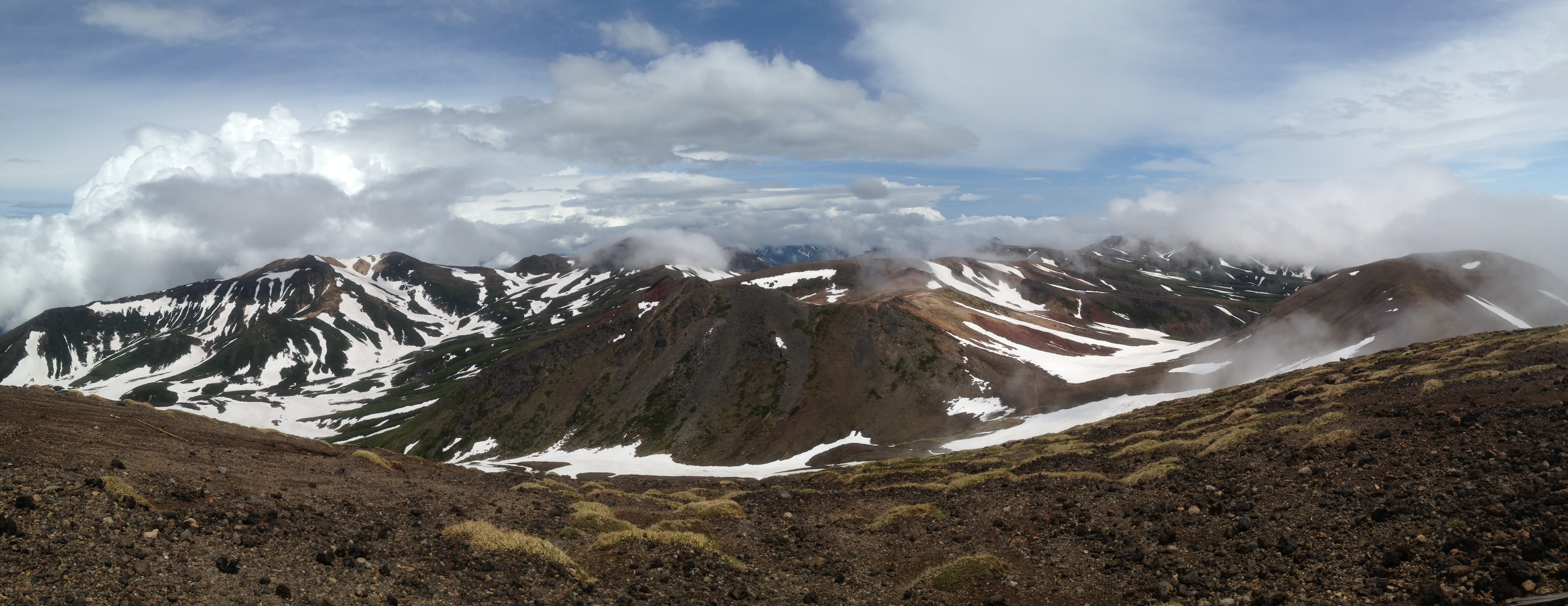 View of some of the Ishikari Mountains from the summit of Asahi-dake, the tallest mountain on the Japanese island of Hokkaido. 