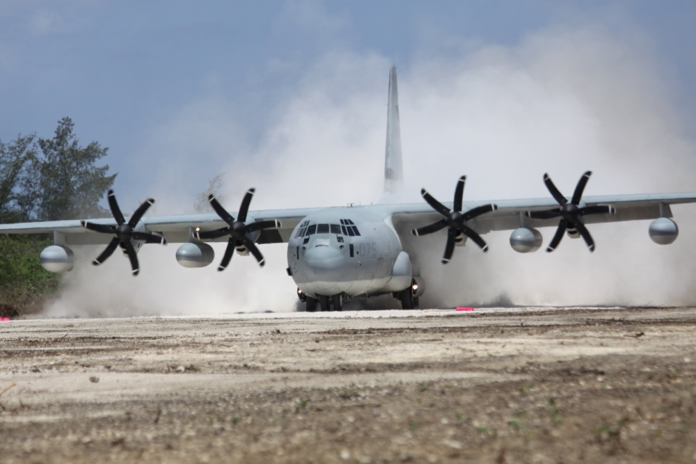 A US Marine Corps KC-130J Hercules aircraft lands on Tinian Island's North Field runway, 30 May 2012, during Exercise Geiger Fury 2012. The aircraft was the first to land on the runway since 1947. Runways Baker, Charlie, Dog, and the historic Able - the runway used by the B-29 Enola Gay on its mission against Hiroshima - are slated to be restored by US Marines. Photo courtesy of US Marine Corps / Lance Cpl. Benjamin Pryer.