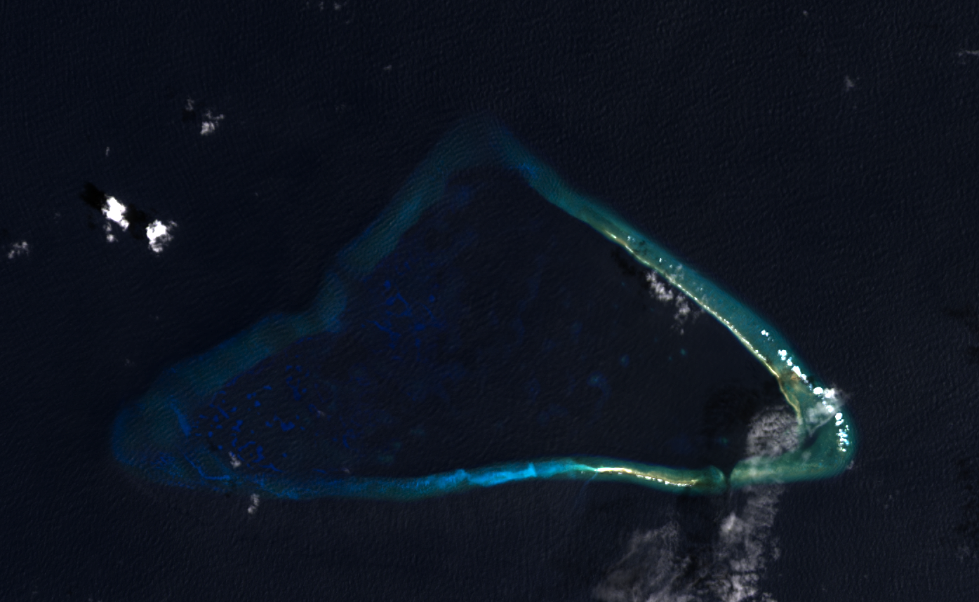 Landsat photo gives clear view of the entire triangular shape of Kingman Reef and distinctly shows the roughly two-thirds that is submerged and one-third that is exposed. Image courtesy of NASA.