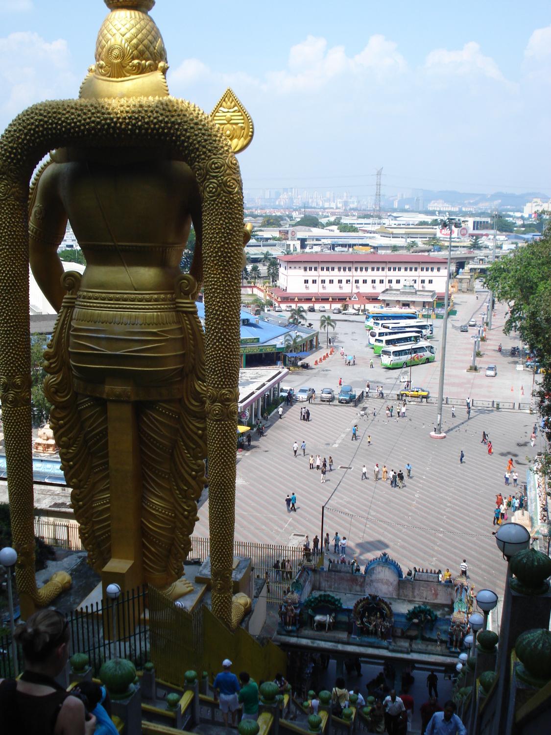 The statue of Lord Murugan, a Hindu deity, overlooks the plaza before the Batu Caves. 
